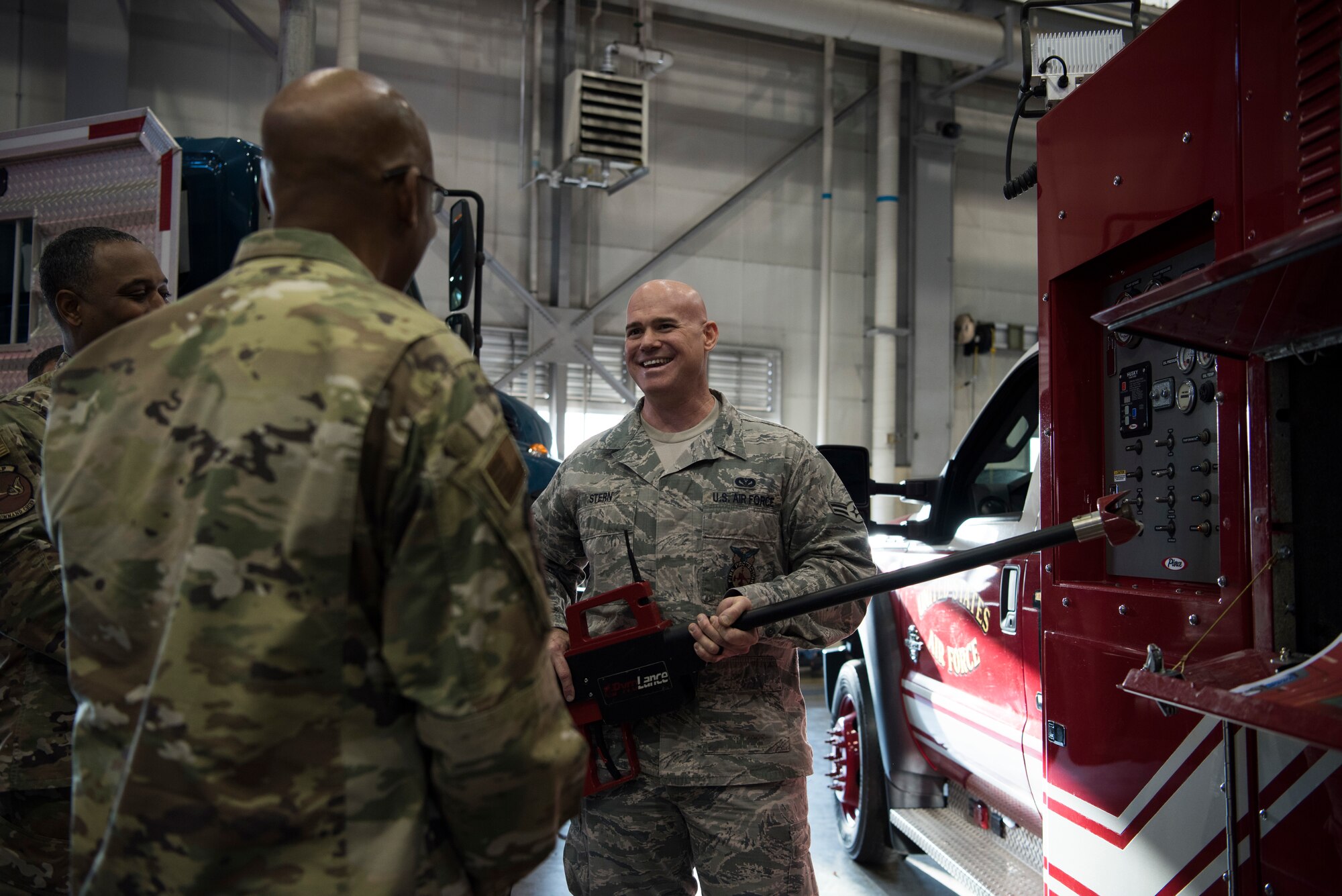 U.S. Air Force Airman 1st Class Eric Stern, 35th Civil Engineering fire protection apprentice, shows Gen. CQ Brown Jr., Pacific Air Forces commander, a pyrolance at Misawa Air Base, Japan, Nov. 14, 2019. Airmen had the ability to showcase their unit’s materials while speaking with Brown in regard to their impact and importance of being stationed in the Indo-Pacific region. (U.S. Air Force Photo by Senior Airman Collette Brooks)