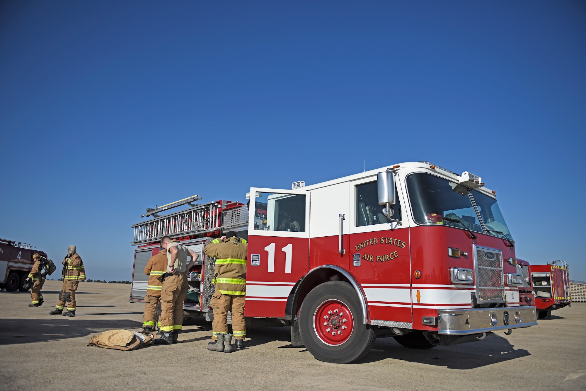 U.S. Air Force firefighters assigned to the 8th Civil Engineer Squadron prepare to conduct live fire training at Kunsan Air Base, Republic of Korea, Nov. 20, 2019. Conducting training allows firefighters to practice and perfect strategies to successfully fight fires in real-world scenarios. (U.S. Air Force photo by Staff Sgt. Mackenzie Mendez)