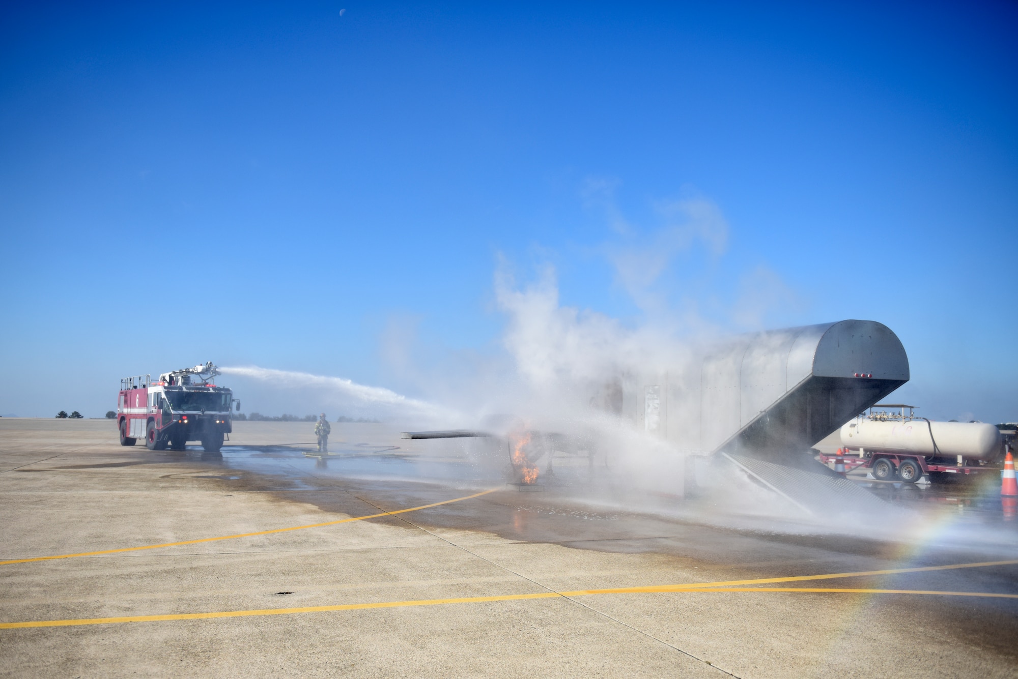 U.S. Air Force firefighters assigned to the 8th Civil Engineer Squadron conduct live aircraft fire training at Kunsan Air Base, Republic of Korea, Nov. 20, 2019. The training helps firefighters and trainers gain experience while also building cohesiveness within their team. (U.S. Air Force photo by Staff Sgt. Mackenzie Mendez)