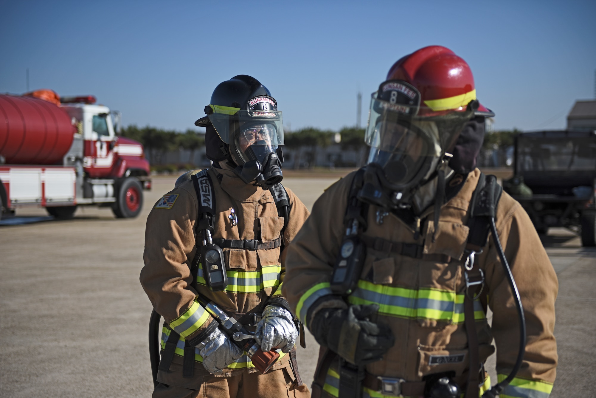 U.S. Air Force firefighters assigned to the 8th Civil Engineer Squadron prepare to conduct live fire training at Kunsan Air Base, Republic of Korea, Nov. 20, 2019. Live aircraft fire training ensures 8th CES firefighters are proficient in the steps needed to properly fight aircraft fires. (U.S. Air Force photo by Staff Sgt. Mackenzie Mendez)