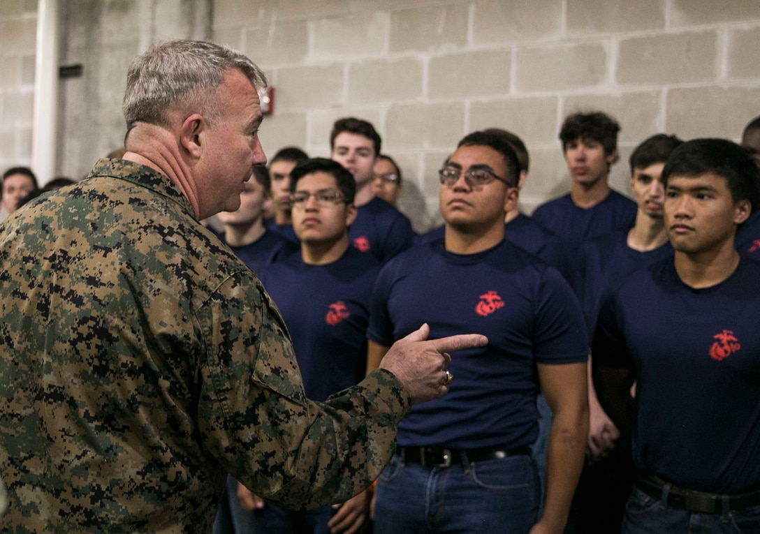 U.S. Marine Corps Gen. Kenneth F. McKenzie, Jr., commander, U.S. Central Command, talks to newly enlisted Marine Corps recruits after an Oath of Enlistment ceremony, Nov. 17, 2019 at Raymond James Stadium. The ceremony was held during halftime of the Tampa Bay Buccaneers Salute to Service game vs. the New Orleans Saints. (U.S. Marine Corps photo by Sgt. Roderick Jacquote)