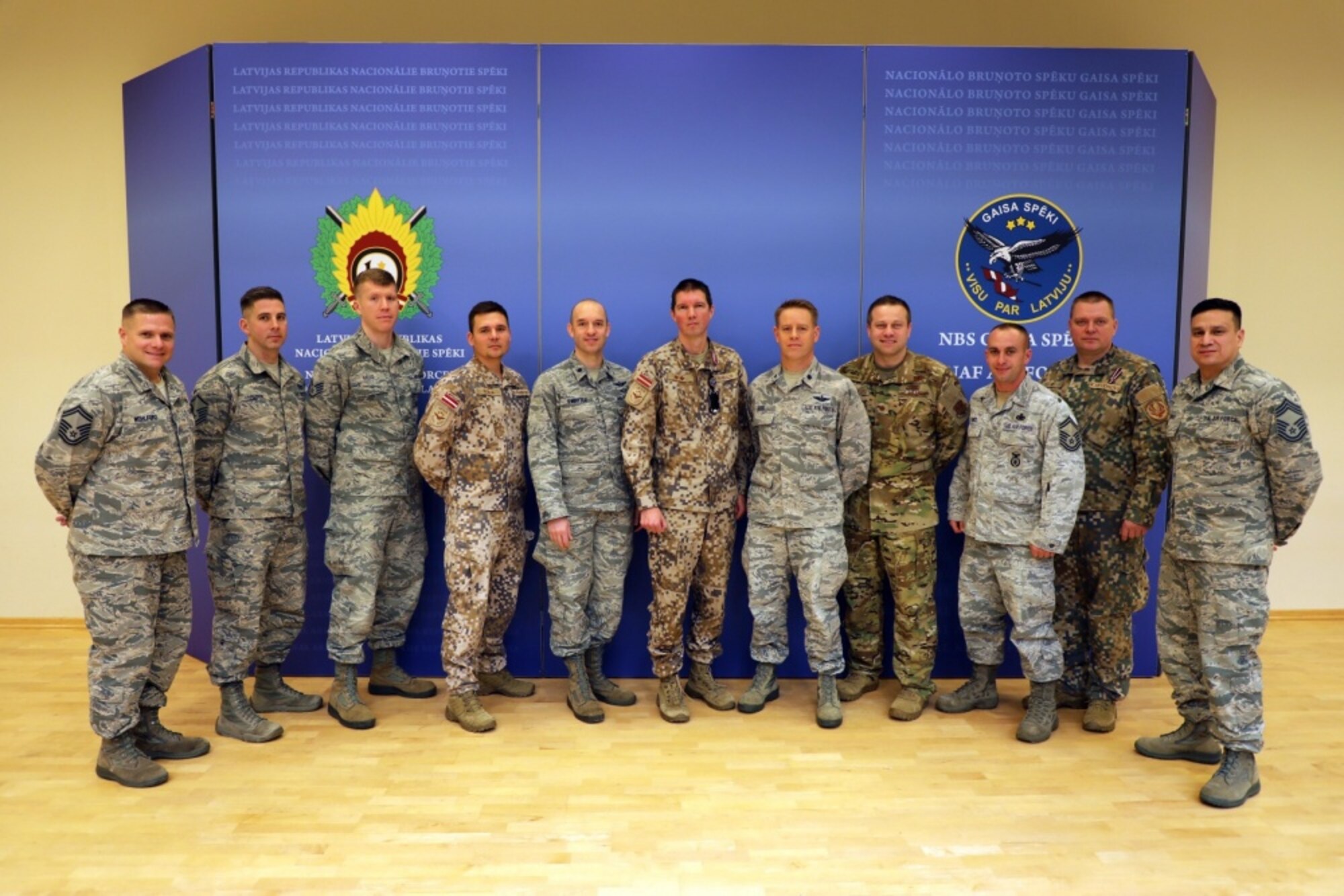 Members of the Michigan Air National Guard and the Latvian Air Force pose for a photo Nov. 15, 2019 after a planning meeting at Lielvārde Air Base, Latvia, to chart cooperation under the National Guard Bureau's State Partnership Program over the coming year (Michigan National Guard Photo by Staff Sgt. Andrew Schumann).