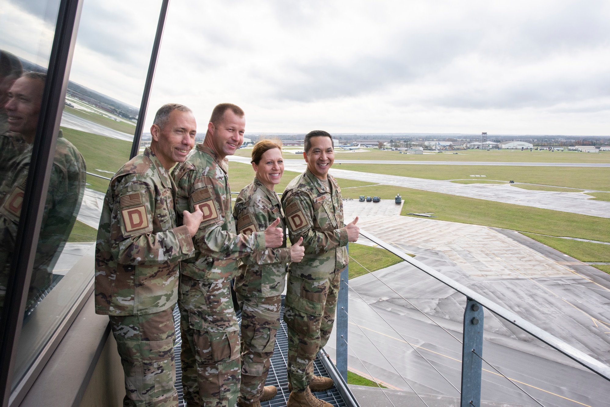 Maj. Gen. John Wilcox, Air Force Installation and Mission Support Center commander, and Chief Master Sgt. Edwin Ludwigsen, AFIMSC command chief master sergeant, pose for a photo with 100th Air Refueling Wing leadership at the control tower Nov. 22, 2019, at RAF Mildenhall, England. The AFIMSC provides installation and mission support that enables Team Mildenhall to complete its varied mission sets. (U.S. Air Force photo by Airman 1st Class Joseph Barron)