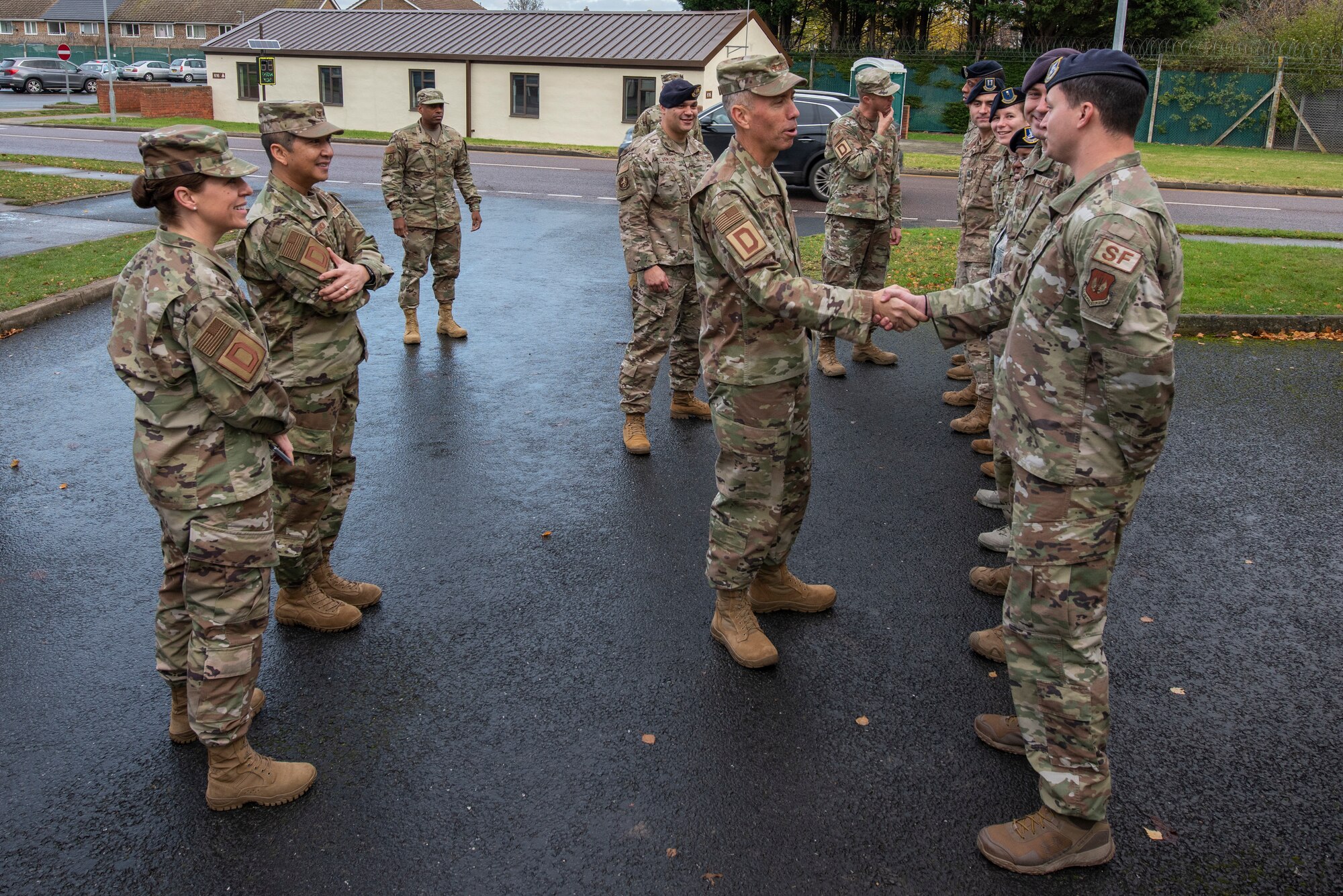 Maj. Gen. John Wilcox, Air Force Installation and Mission Support Center commander, greets members of the 100th Security Forces Squadron Nov. 22, 2019, at RAF Mildenhall, England. The AFIMSC provides base communications, civil engineering, security forces and logistics support that assists Team Mildenhall in fulfilling its mission sets. (U.S. Air Force photo by Airman 1st Class Joseph Barron)