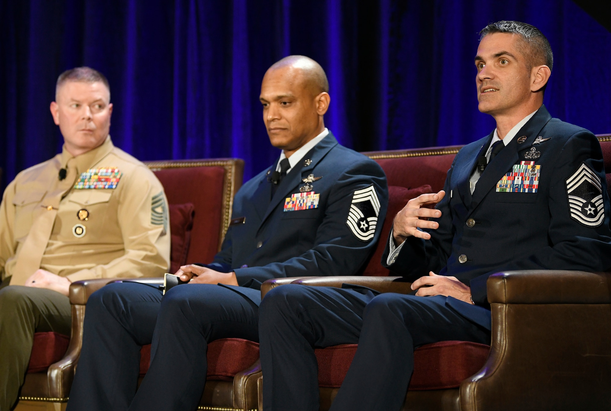 U.S. Air Force Chief Master Sgt. Bryan Neumann (right), Sixteenth Air Force Cyberspace Operations superintendent, speaks to Alamo Armed Forces Communication and Engineering Association Chapter Event attendees in San Antonio, Texas, Nov. 20, 2019, as (left to right) U.S. Marine Corps Master Gunnery Sgt. Scott Stalker, command senior enlisted leader of U.S. Cyber Command, and U.S. Air Force Chief Master Sgt. Andrew Small, 67th Cyberspace Operations Group superintendent, listen in. The three sat on an SEL panel during the annual cyber- and technology-focused conference to discuss cyber enlisted matters. (U.S. Air Force photo by Tech. Sgt. R.J. Biermann)