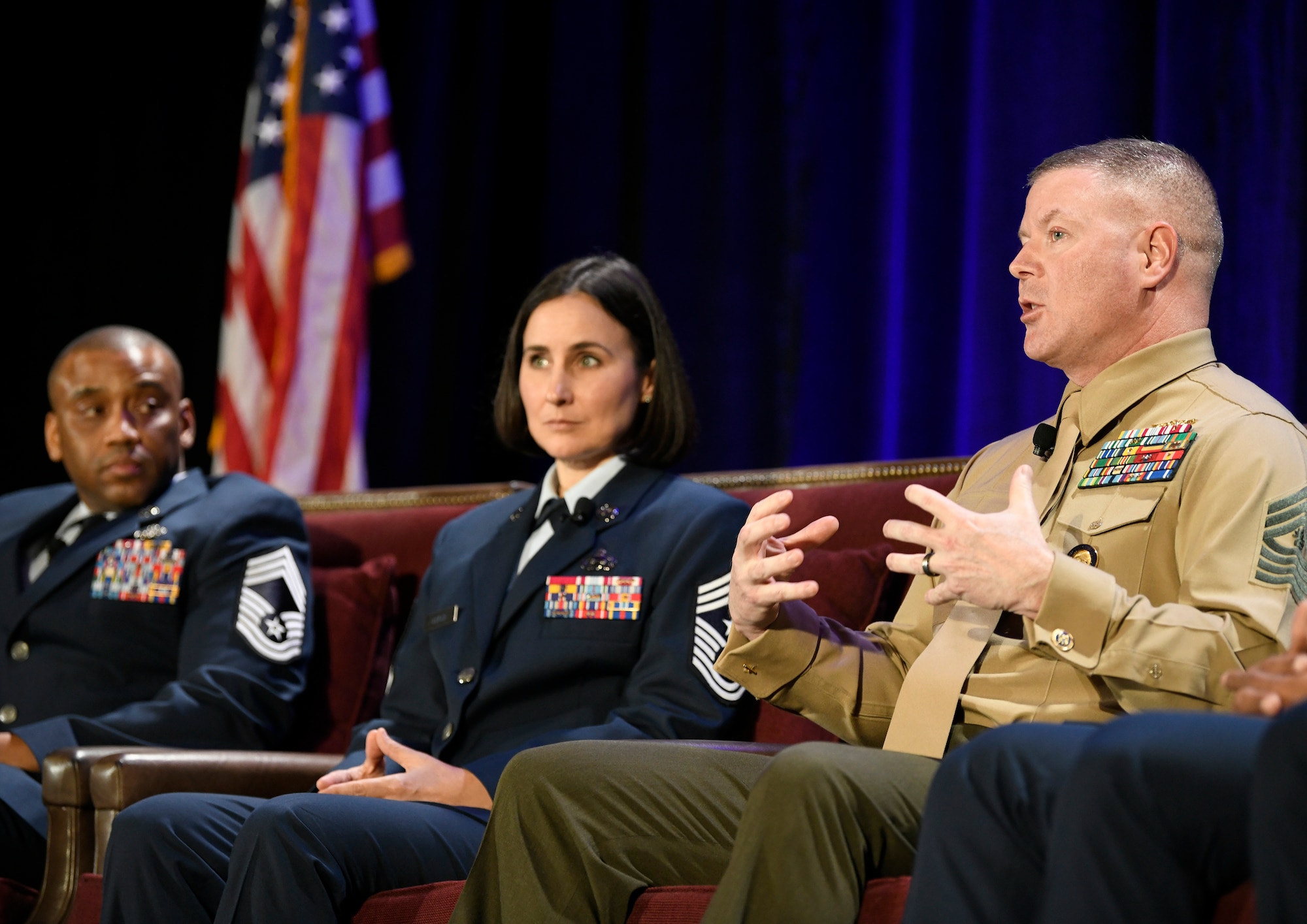 U.S. Marine Corps Master Gunnery Sgt. Scott Stalker, command senior enlisted leader of U.S. Cyber Command (right), speaks to Alamo Armed Forces Communication and Engineering Association Chapter Event attendees in San Antonio, Texas, Nov. 20, 2019, as (left to right) U.S. Air Force Chief Master Sgt. Harold Terrance, Jr., 33rd Network Warfare Squadron superintendent, and U.S. Air Force Chief Master Sgt. Summer Leifer, Sixteenth Air Force command chief, listen in. The three sat on an SEL panel during the annual cyber- and technology-focused conference to discuss cyber enlisted matters. (U.S. Air Force photo by Tech. Sgt. R.J. Biermann)