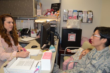 Bianca Rodriguez (left), a breast nurse navigator at Brooke Army Medical Center at Joint Base San Antonio-Fort Sam Houston, talks with breast cancer survivor Air Force Staff Sgt. Desiree Mora Mundt Oct. 31. As a breast nurse navigator, Rodriguez serves as an advocate for her patients, arranging surgery, acting as a go-between for the patient and their provider and even coordinating transportation to and from appointments.