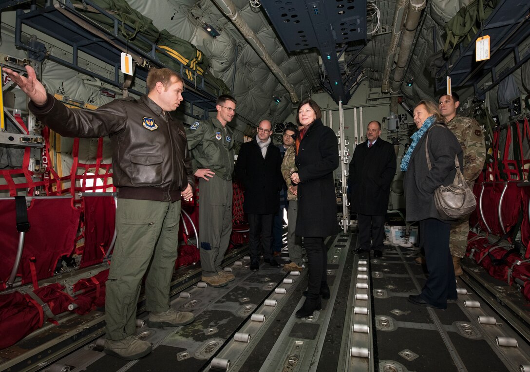 Nicole Steingaß, middle, Rheinland-Palatinate state secretary, listens as U.S. Air Force Tech. Sgt. Jonathan Hernandez, 37th Airlift Squadron loadmaster, briefs her and other German officials during a tour of a C-130J Super Hercules aircraft on Ramstein Air Base, Germany, Nov. 20, 2019. Steingaß requested the visit to get to know the base firsthand and familiarize herself with some of Ramstein’s people, operations and capabilities.