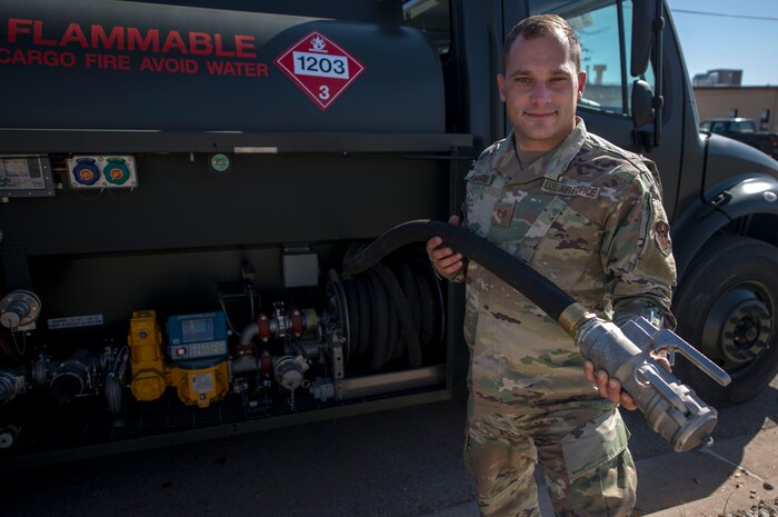 Tech. Sgt. Thomas Harris, 49th Logistics Readiness Squadron non-commissioned officer in charge of fuels distribution, holds a modified nozzle made for ground fuels, Nov. 14, 2019, on Holloman Air Force Base, N.M. The fuels distribution element recently purchased two R-13 Mobile Refueling Unit vehicles to ensure ground equipment and vehicles are getting the fuel they need. (U.S. Air Force photo by Staff Sgt. Christine Groening)