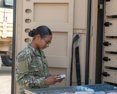 U.S. Army Spc. Tamara Murrill, a supply specialist in the 230th Brigade Support Battalion, 30th Armored Brigade Combat Team, North Carolina Army National Guard, works in the supply area supporting the 1-252 Armor Regiment in Kuwait, Nov. 25, 2019. This is the first time Murrill will be away from home during the holidays, deployed for Operation Spartan Shield.