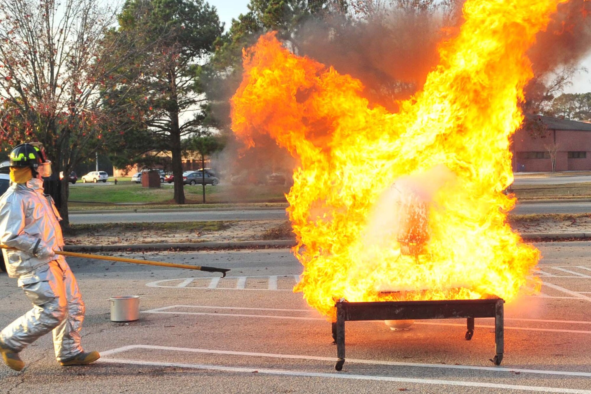 Photo of turkey fryer fire demonstration with cooking apparatus engulfed in flames.