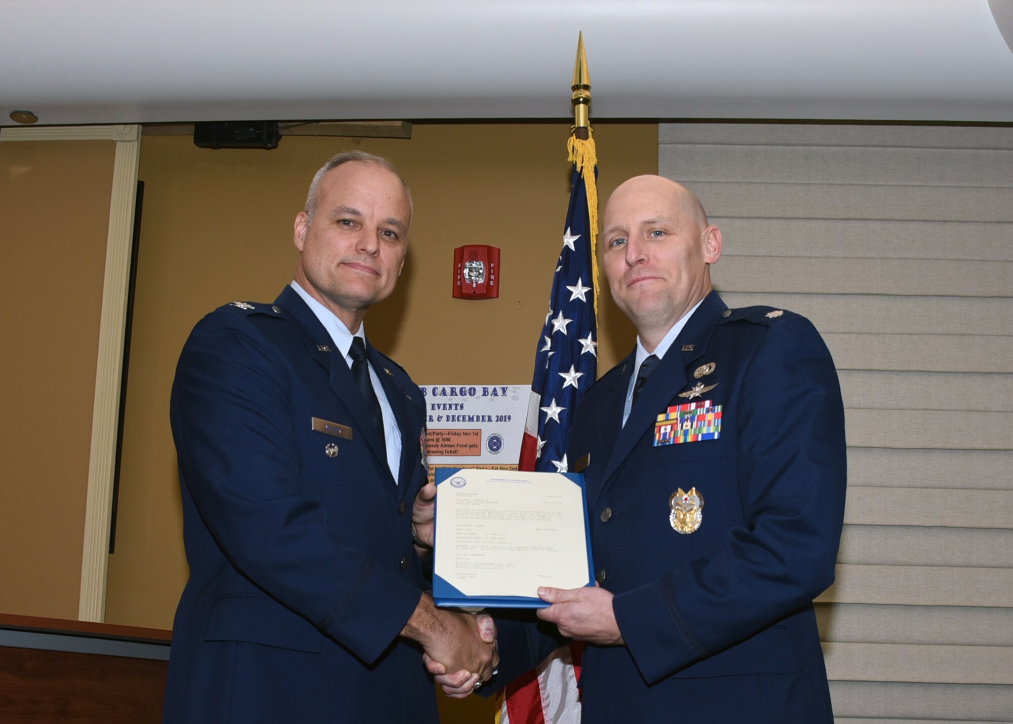 Col. Jay Miller, vice commander of the 911th Airlift Wing, poses for a photo with Col. Leland Shea during Shea’s promotion ceremony at the Pittsburgh International Airport Air Reserve Station, Pennsylvania, Nov. 2, 2019.