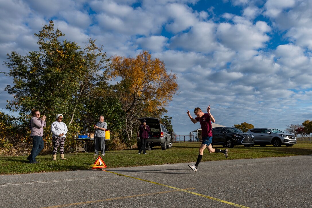 A photo of the winner of the Health and Readiness Optimization Dash 4K crossing the finish line