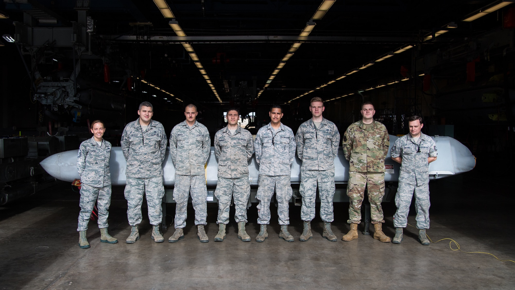 Airmen from the 2nd Munitions Squadron pose for a photo in front of the final Conventional Air-Launched Cruise Missile (CALCM) at Barksdale Air Force Base, La., Nov. 20, 2019. The 2nd MUNS disassembled the final CALCM package for it to become retired and demilitarized. (U.S. Air Force photo by Airman 1st Class Jacob B. Wrightsman)
