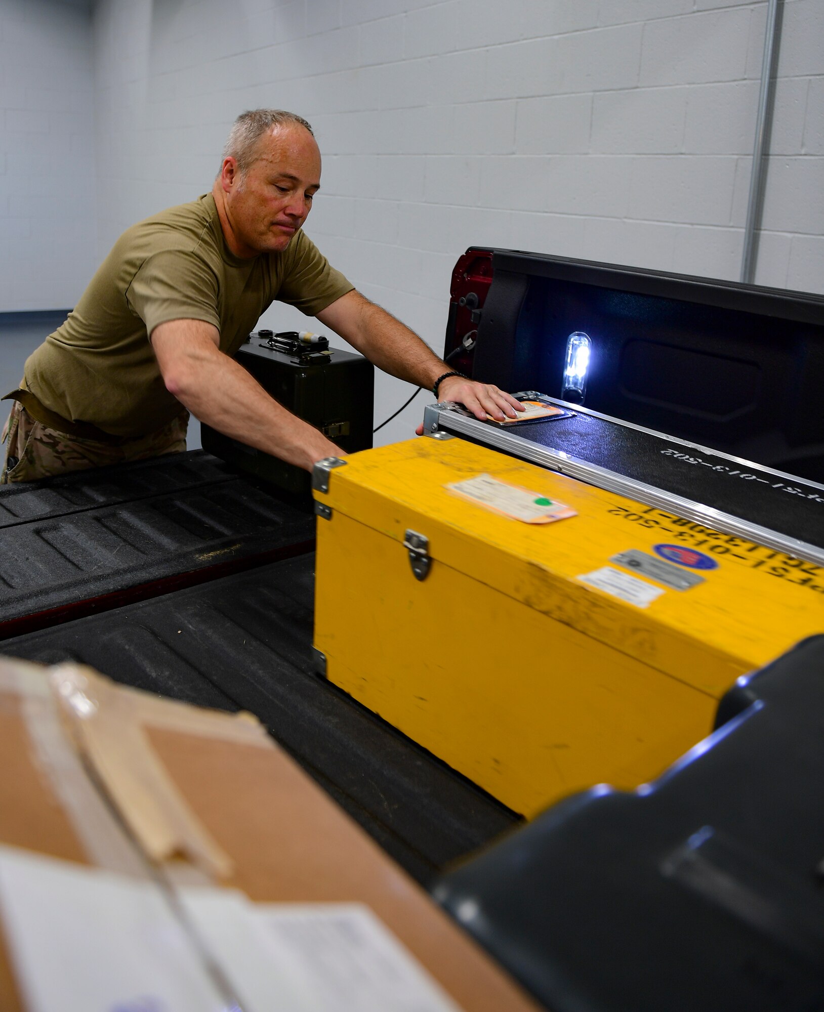 Master Sgt. Matthew Lamp, 911th Aircraft Maintenance Squadron sortie support flight non-commissioned officer in charge, moves a tool chest into the new 911th Maintenance Group tool room at the Pittsburgh International Airport Air Reserve Station, Pennsylvania, Oct. 2, 2019.