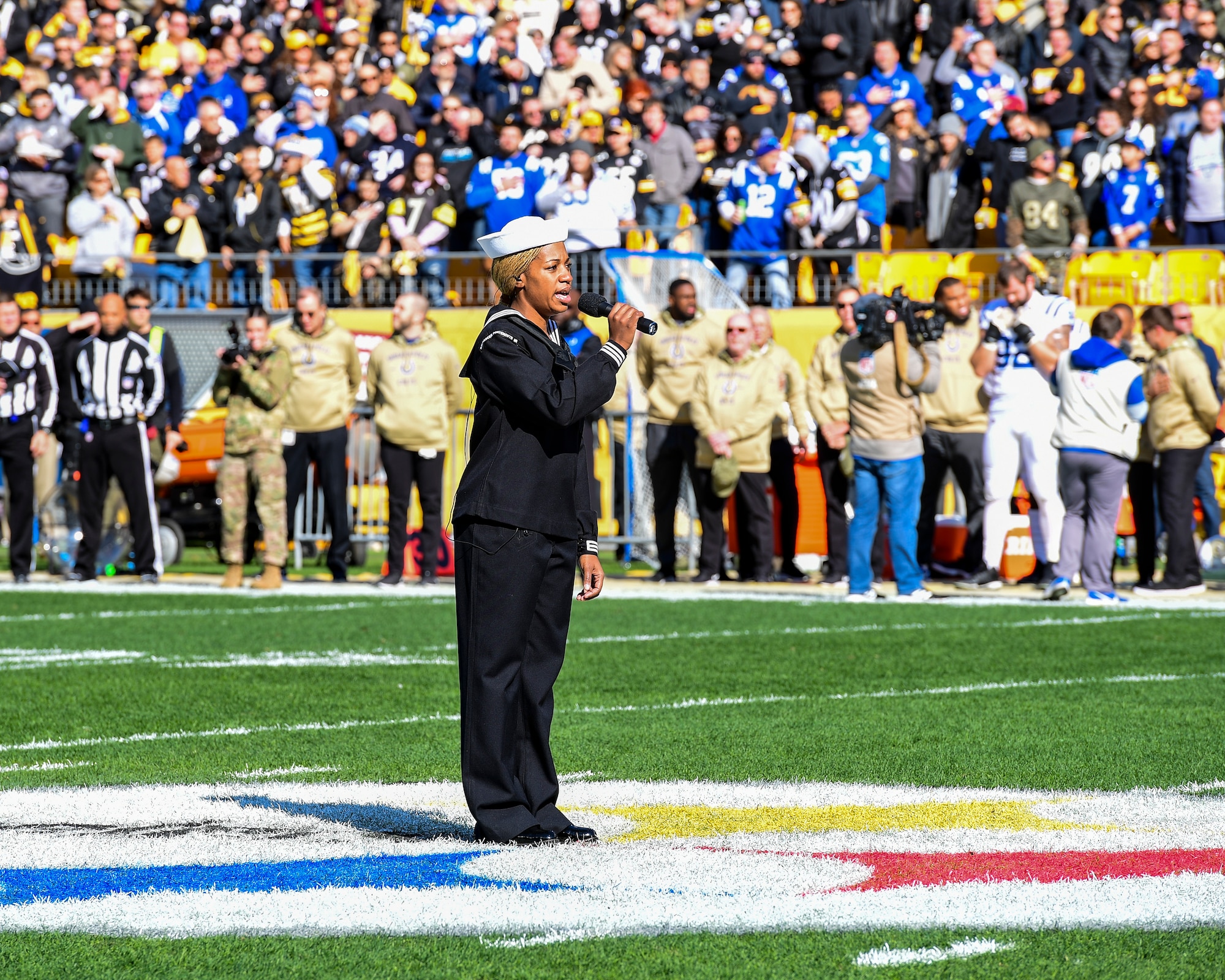 U.S. Navy Hospital Corpsman 1st Class Tanqueray Hayward performs the National Anthem at a Pittsburgh Steelers vs. Indianapolis Colts game at Heinz Field in Pittsburgh, Pennsylvania, November 3, 2019.