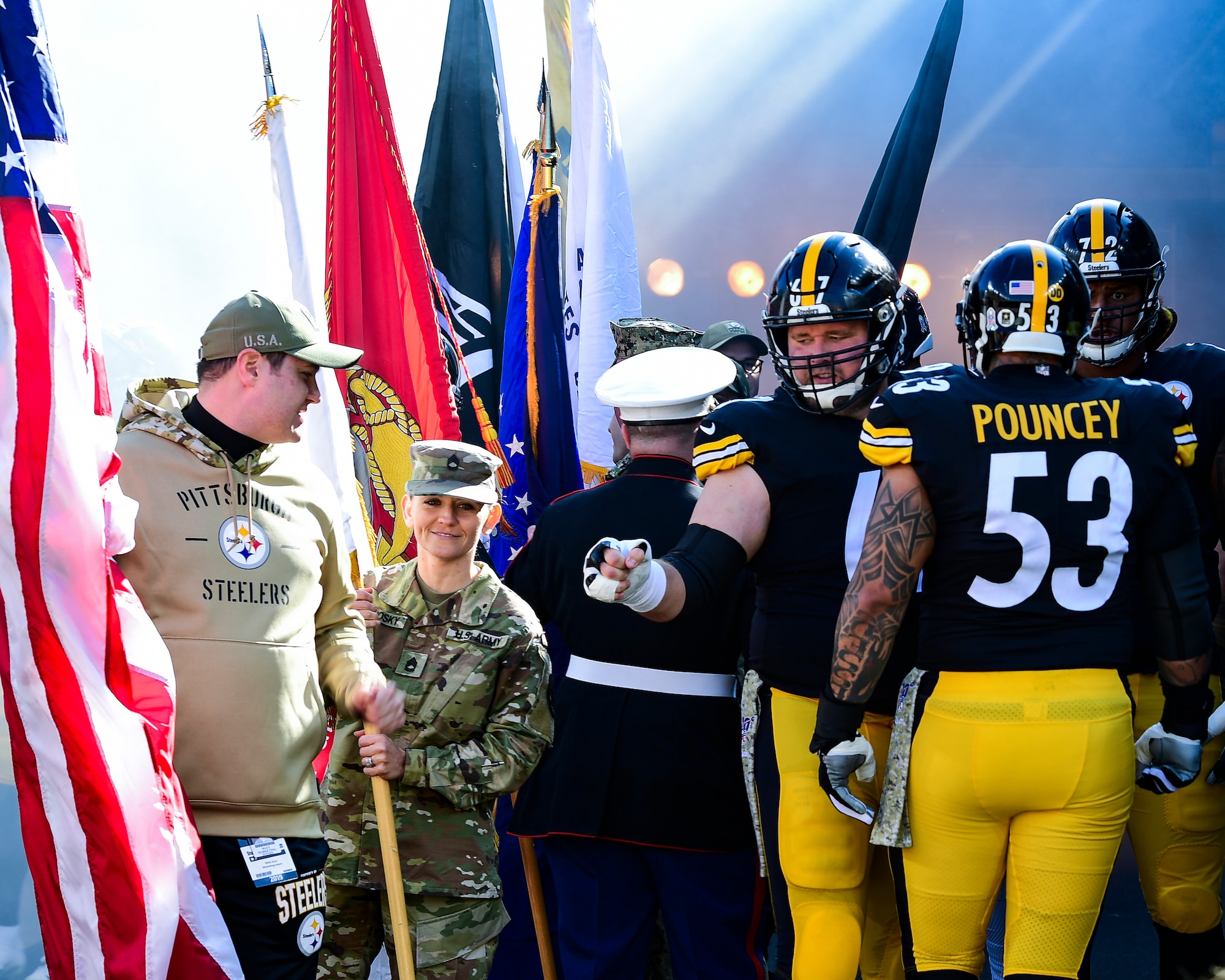 Pittsburgh Steelers offensive lineman BJ Finney reaches out to fist-bump a military veteran before a Pittsburgh Steelers vs. Indianapolis Colts game at Heinz Field in Pittsburgh, Pennsylvania, November 3, 2019.