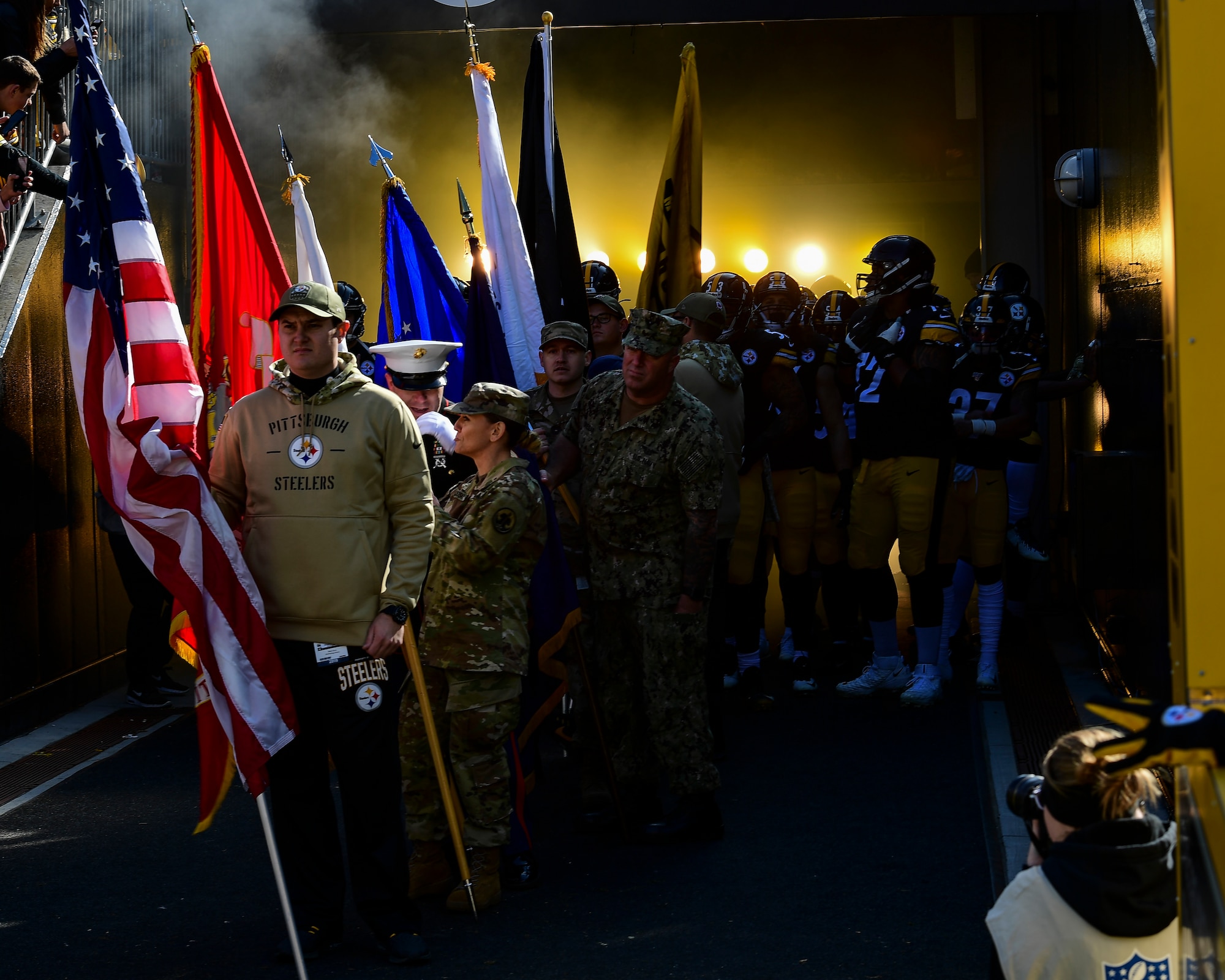 Veterans and service members prepare to run onto the field with their respective service flags before a Pittsburgh Steelers vs. Indianapolis Colts game at Heinz Field in Pittsburgh, Pennsylvania, November 3, 2019.