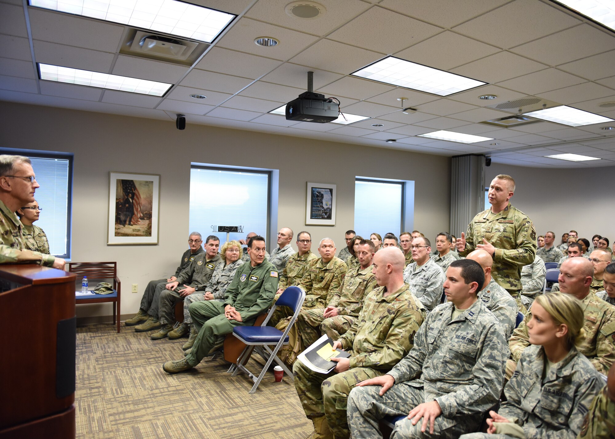 Maj. Gen. Randall A. Ogden, 4th Air Force commander, listens to a question posed by Senior Master Sgt. David Miller, 911th Aeromedical Evacuation Squadron, at the Pittsburgh International Airport Air Reserve Station, Pennsylvania, Nov. 3, 2019.