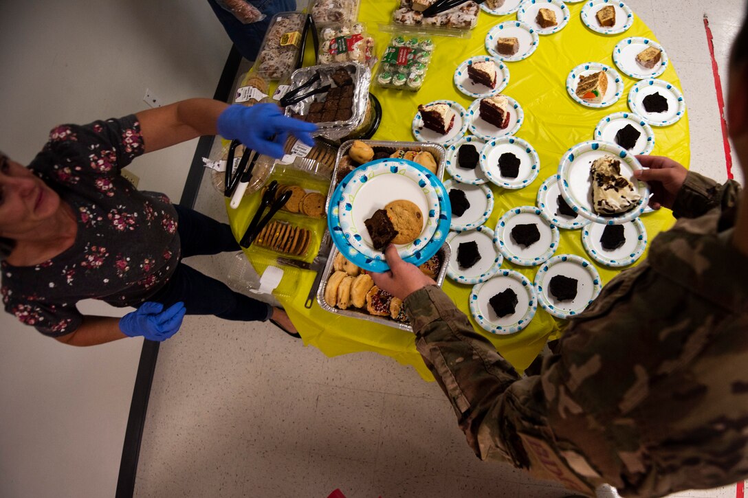A photo of an Airman getting dessert during the Annual Airman Thanksgiving Lunch