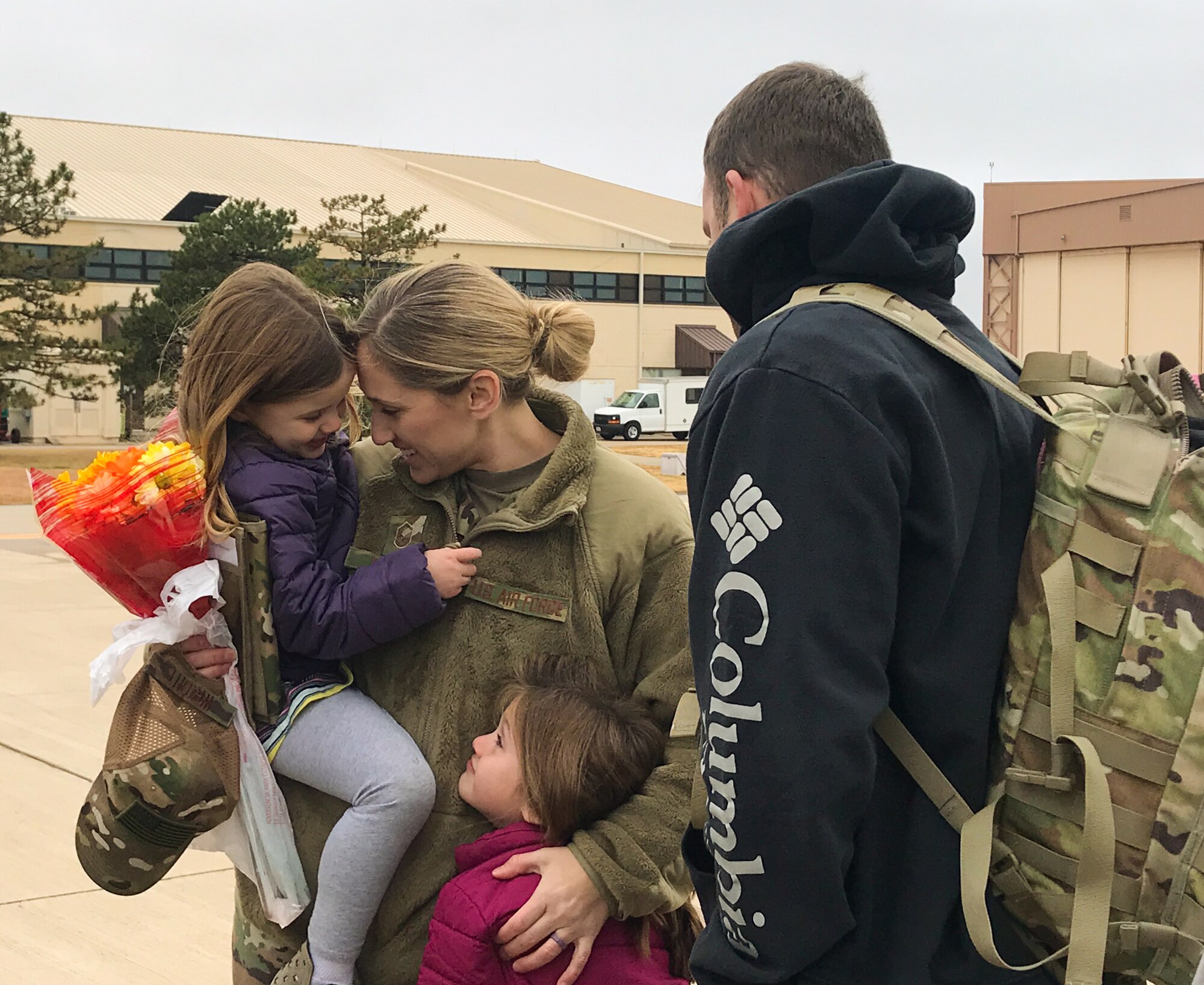 Master Sgt. Jennifer Wright, all-source intelligence analyst with the 507th Operations Support Squadron, greets her family upon returning home from a deployment to Southwest Asia Nov. 25, 2019, at Tinker Air Force Base, Oklahoma. (U.S. Air Force photo by Lauren Kelly