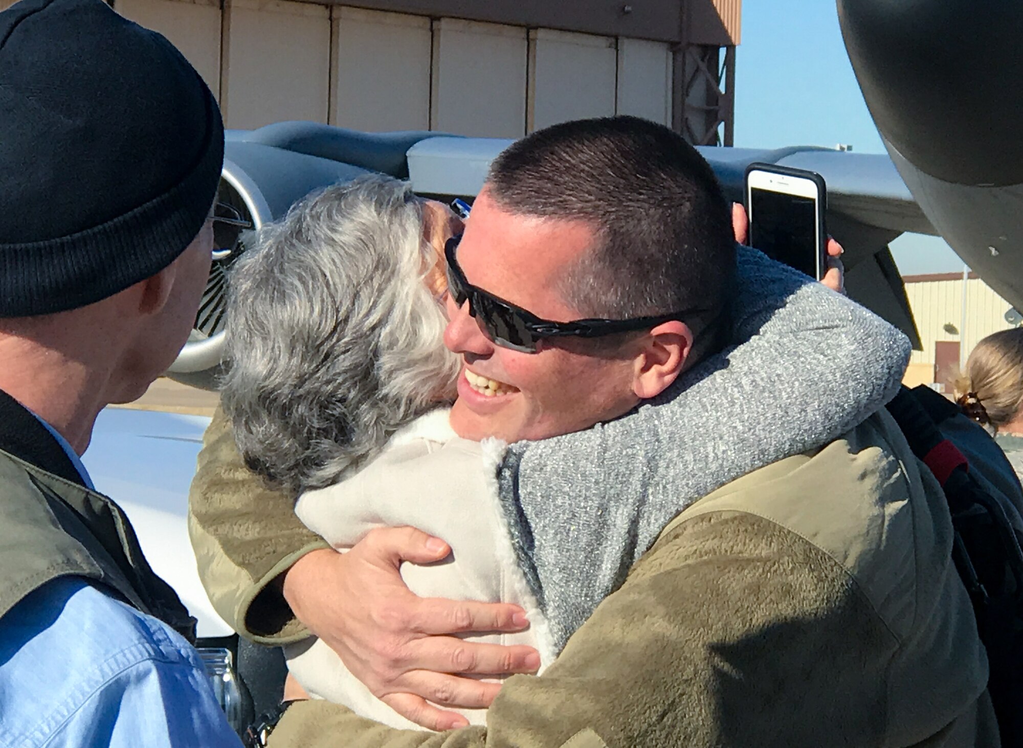 Lt. Col. Stuart Letcher, 507th Operations Support Squadron commander, greets his family upon returning home from a deployment to Southwest Asia Nov. 25, 2019, at Tinker Air Force Base, Oklahoma. (U.S. Air Force photo by Lauren Kelly)