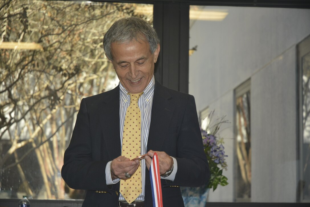 Dr. Zeki Demirbilek, a research hydraulics engineer with the Coastal and Hydraulics Laboratory at the U.S. Army Engineer Research and Development Center, received a giant penny during his retirement ceremony held at the ERDC-Vicksburg main campus, Nov. 15, 2019. Demirbilek is known for handing out pennies to co-workers for accomplishing good works. (U.S. Army photo by Carol C. Coleman)