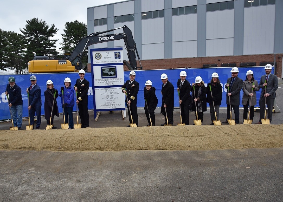 Group of people holding shovels