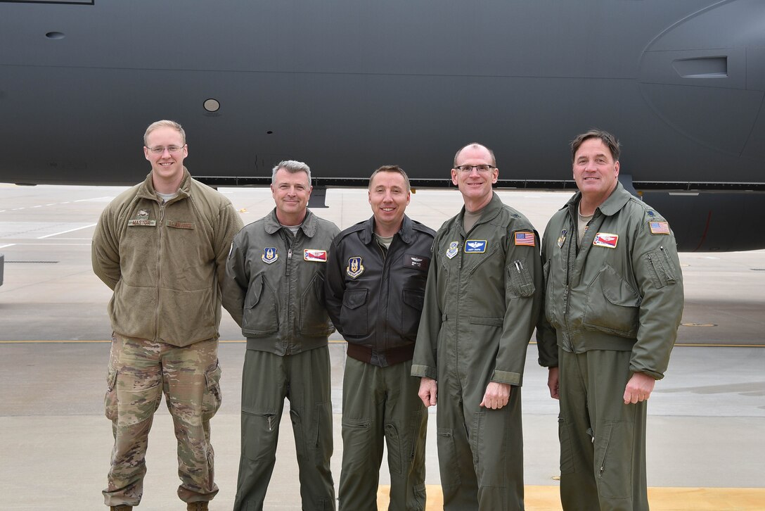 Brig. Gen. Martin B. Chapin, fourth from left, Air Mobility Command deputy director of Strategic Plans, Requirements and Programs, poses with aircrew that delivered McConnell’s 18th KC-46 Pegasus Nov. 22, 2019, at McConnell Air Force Base, Kan.  McConnell will have a fleet of 36 KC-46s to lead the future of aerial refueling. (U.S. Air Force photo by Airman 1st Class Marc Garcia)