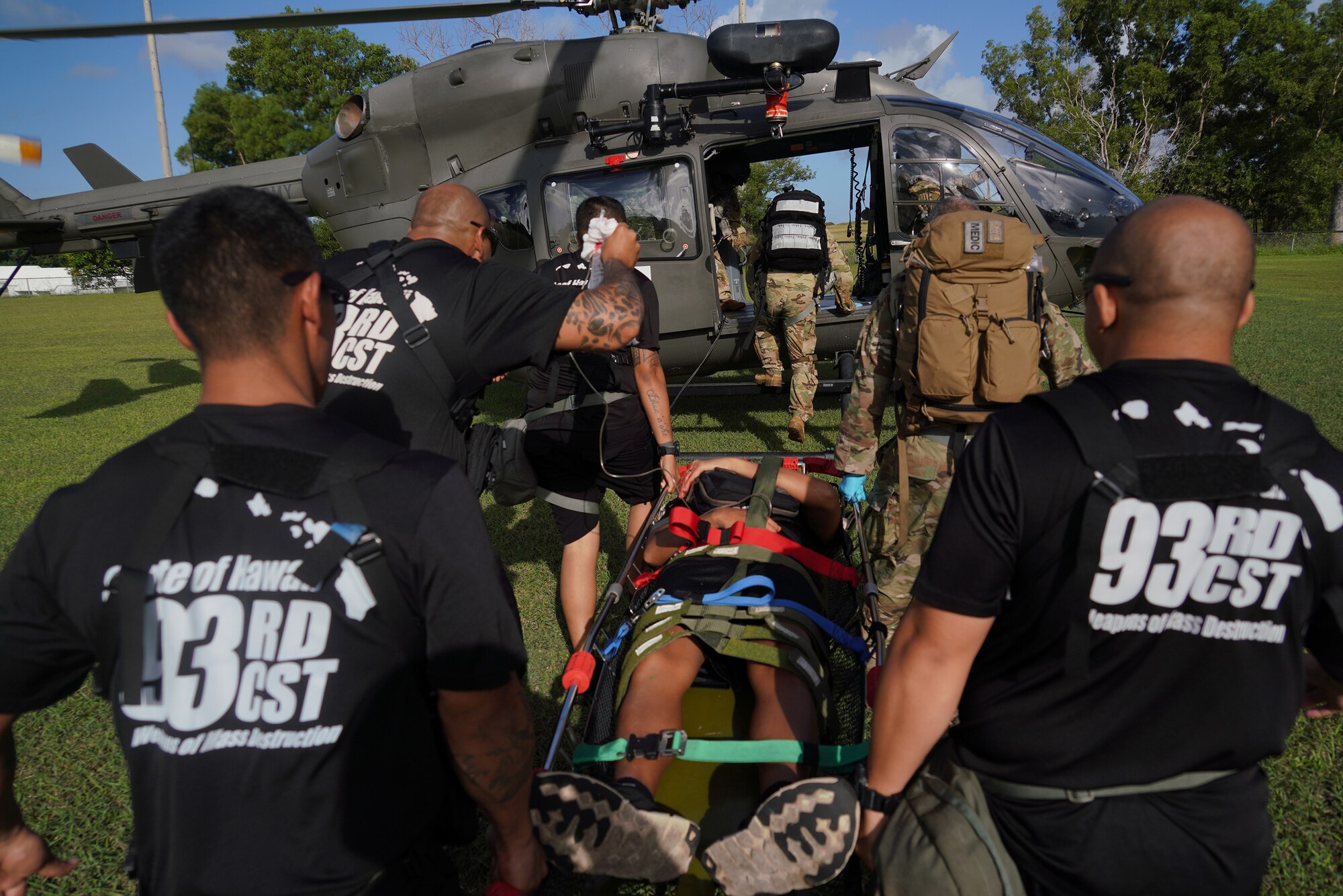 Members of the 93rd CST load an Airman with a simulated injury on a Guam National Guard Lakota helicopter for transport during exercise Vigilant Guard 2020, Guam, Nov. 21, 2019. Vigilant Guard is a series of exercises that take place in each FEMA region annually. The training exercise program sponsored by U.S. Northern Command, in conjunction with National Guard Bureau, provides civilian-military first responders and emergency management personnel the opportunity to evaluate their capabilities and identify areas for improvement, in the most realistic, large-scale disaster scenarios possible. (U.S. Air National Guard photo by Tech. Sgt. Andrew Jackson)
