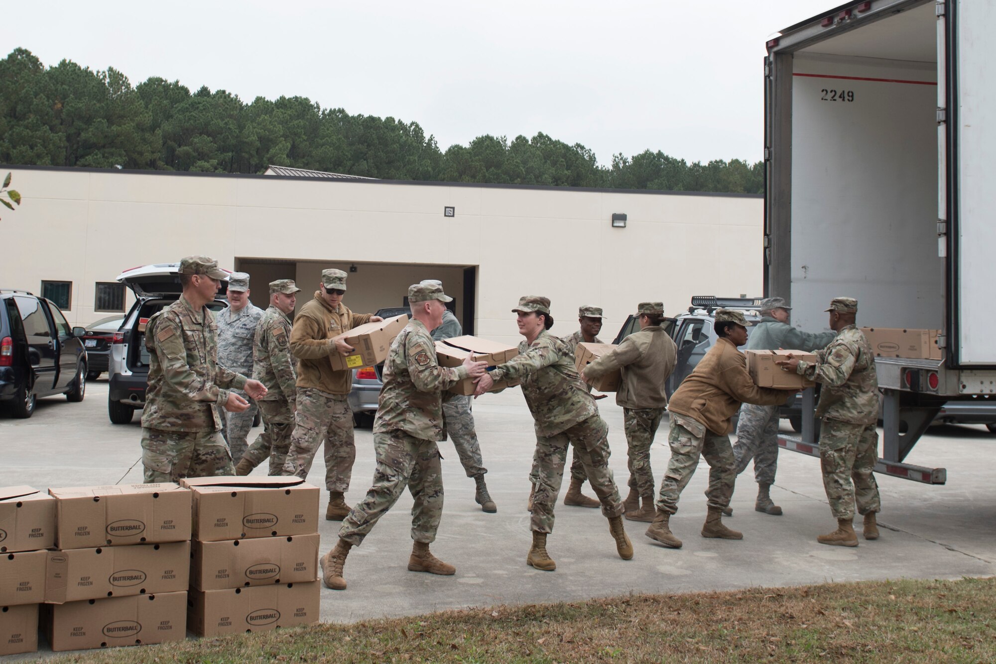 Team Seymour First Sergeants and Airmen unload donated turkeys, Nov. 19, 2019, Seymour Johnson Air Force Base, N.C. SJAFB leaders delivered holiday dinner packages with turkey, stuffing and popular Thanksgiving dinner items. (U.S. Air Force photo by Senior Airman Victoria Boyton)