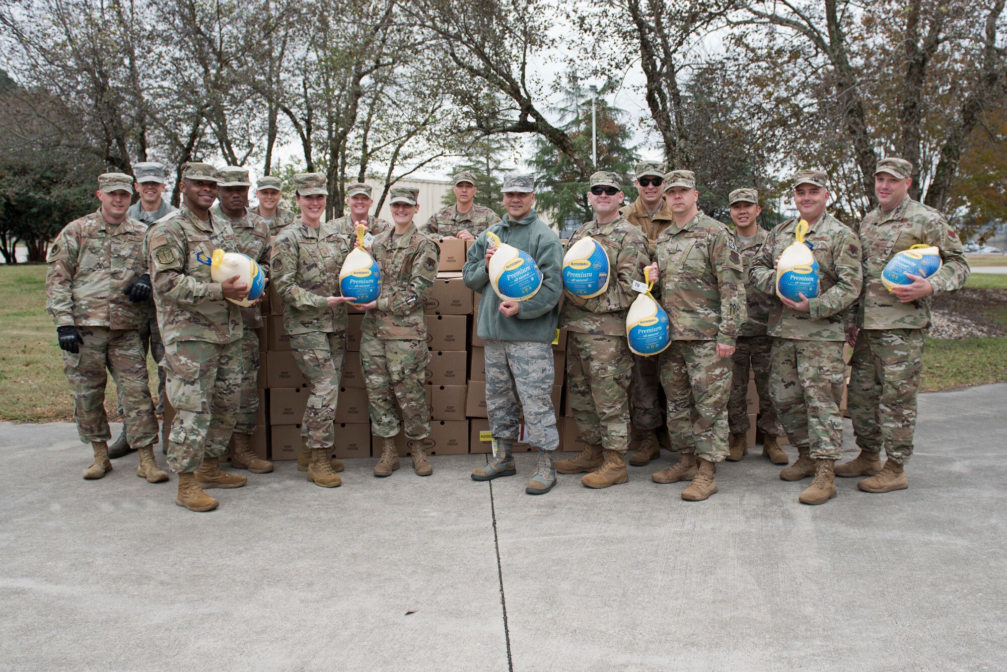 Team Seymour First Sergeants prepare to donate turkeys during Operation Warm Heart, Nov. 19, 2019, Seymour Johnson Air Force Base, N.C. Airmen throughout SJAFB were chosen by their leadership to receive a turkey and side dish items for Thanksgiving dinner. (U.S. Air Force Photo by Senior Airman Victoria Boyton)