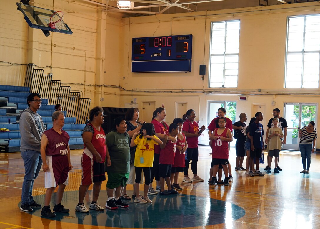 Special Olympics athletes line up to receive awards on Joint Base Pearl Harbor-Hickam, Hawaii, Nov. 23, 2019. The Special Olympics collectively offer 10 different sports and 50 games for athletes throughout the year. (U.S. Air Force photo by Airman 1st Class Erin Baxter)