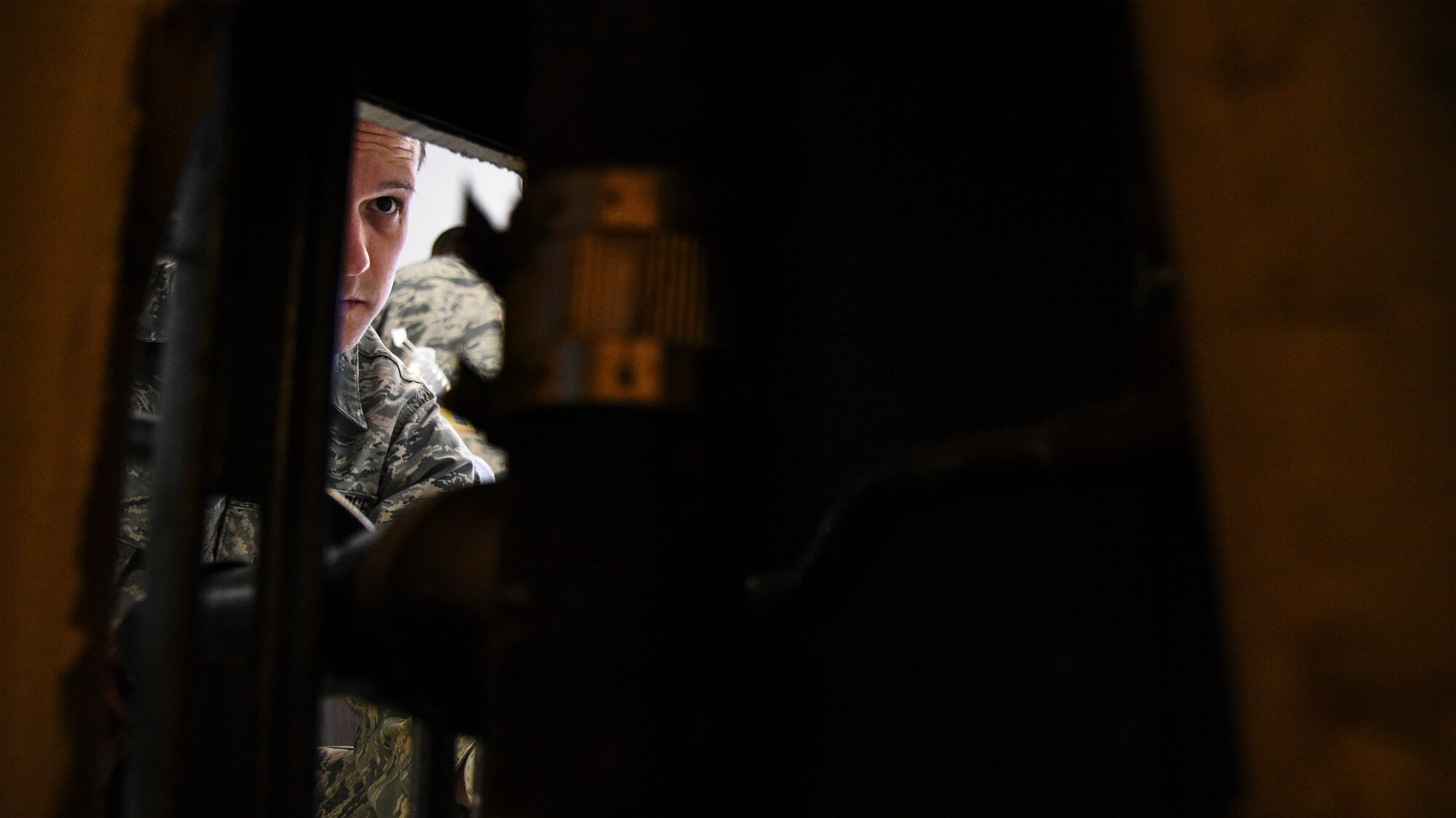 a photo of an Airman seting up a water fountain.