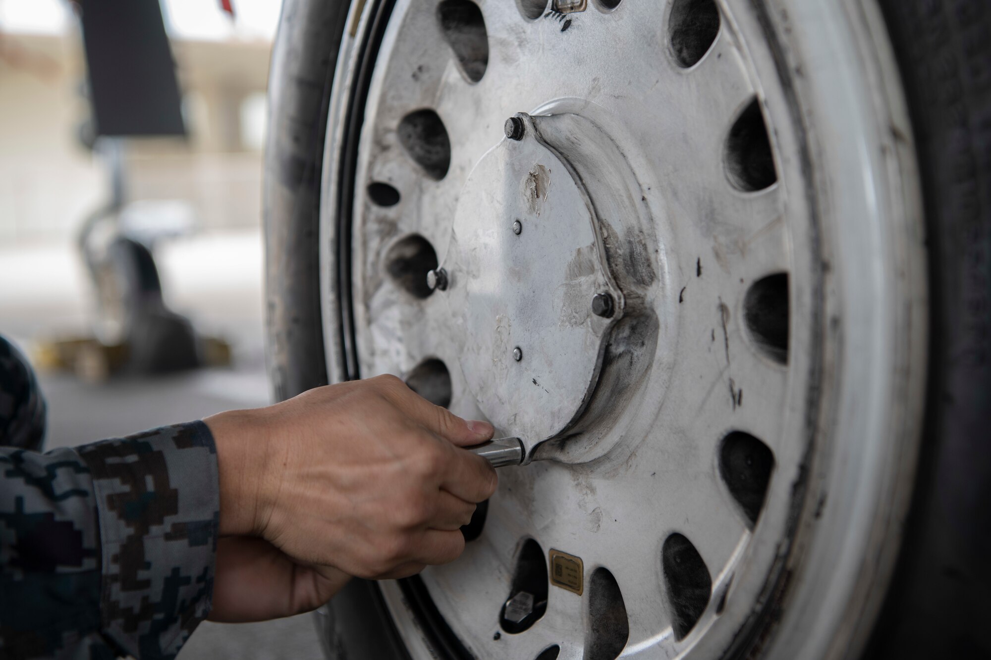 Japanese Self-Defense Force Staff Sgt. Shuichiro Masunaga, 6th Tactical Fighter Squadron aircraft general technician trains on changing tires on an F-15C Eagle as part of an NCO Bilateral Exchange program Nov. 19, 2019, at Kadena Air Base, Japan. Bilateral exchanges allow for a better understanding of the capabilities held by each countries Armed Forces, as well as the opportunity to improve relations between the United States and Japan. (U.S. Air Force photo by Senior Airman Rhett Isbell)