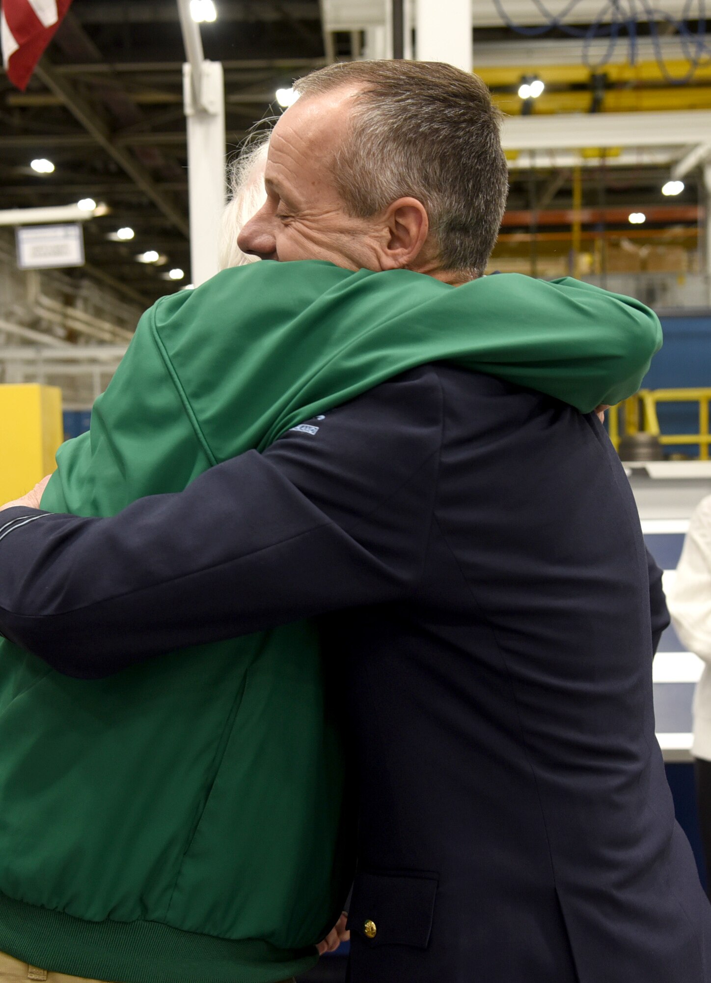 An image of Dwight Journey and Royal Netherlands Air Force 1st Lt. Willem van der Steen embracing after van der Steen returned the dog tags of TSgt. Bruce Journey