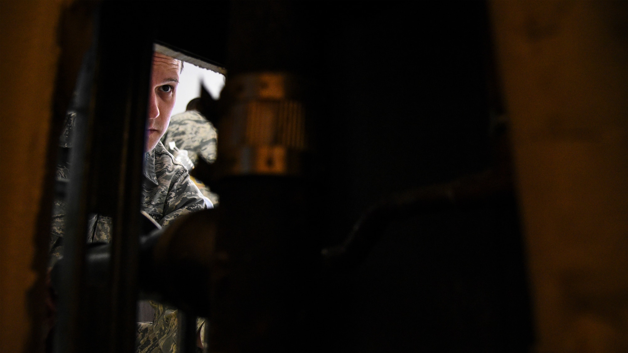 An Airman sets up a water fountain.