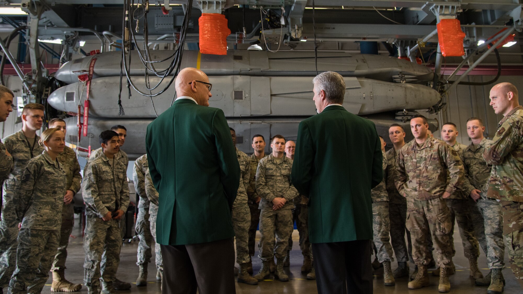 Retired Cols. Warren Ward (left) and Trey Morriss (right), members of Operation Secret Squirrel, speak to Airmen during the final download of the Conventional Air-Launched Cruise Missile (CALCM) package at Barksdale Air Force Base, La., Nov. 20, 2019. Operation Secret Squirrel was the first time CALCM missiles were used in combat. (U.S. Air Force photo by Airman 1st Class Jacob B. Wrightsman)