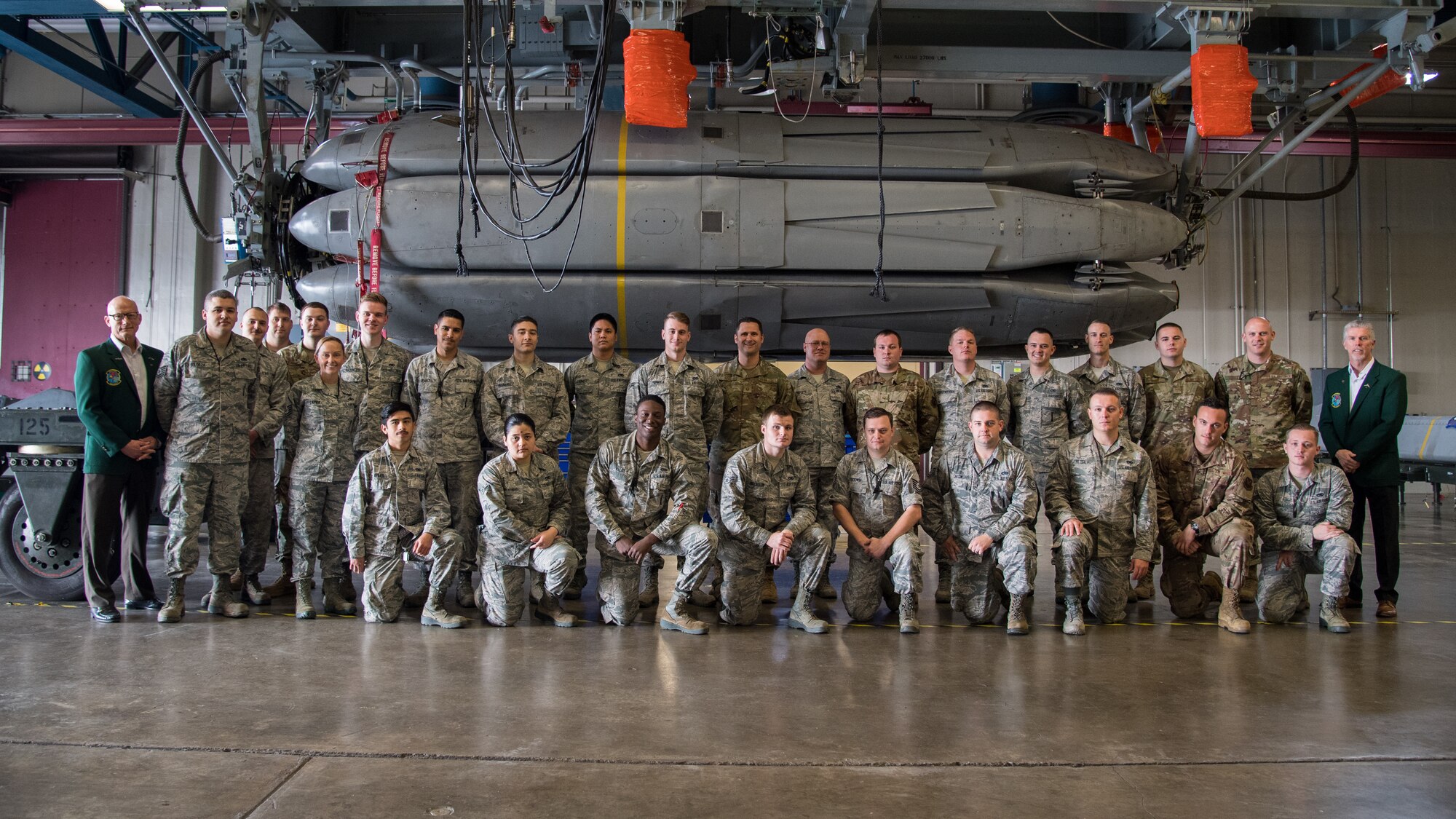 Airmen from the 2nd Munitions Squadron alongside retired Cols. Warren Ward (far left) and Trey Morriss (far right), members of Operation Secret Squirrel, pose in front of the final Conventional Air-Launched Cruise Missile (CALCM) package at Barksdale Air Force Base, La., Nov. 20, 2019. The CALCM missile package is being retired and replaced by more advanced Long-Range Stand-Off (LRSO) weapons. (U.S. Air Force photo by Airman 1st Class Jacob B. Wrightsman)