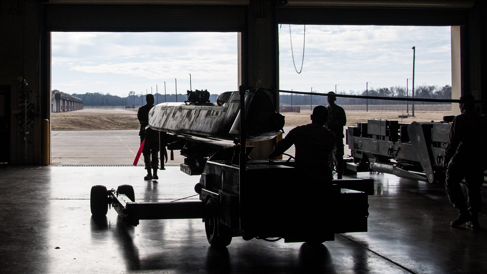 Airmen from the 2nd Munitions Squadron transport the final Conventional Air-launched Cruise Missile (CALCM) to be demilitarized at Barksdale Air Force Base, La., Nov. 20, 2019. The CALCM missile package was first operationally used in 1991 during Operation Secret Squirrel. (U.S. Air Force photo by Airman 1st Class Jacob B. Wrightsman)