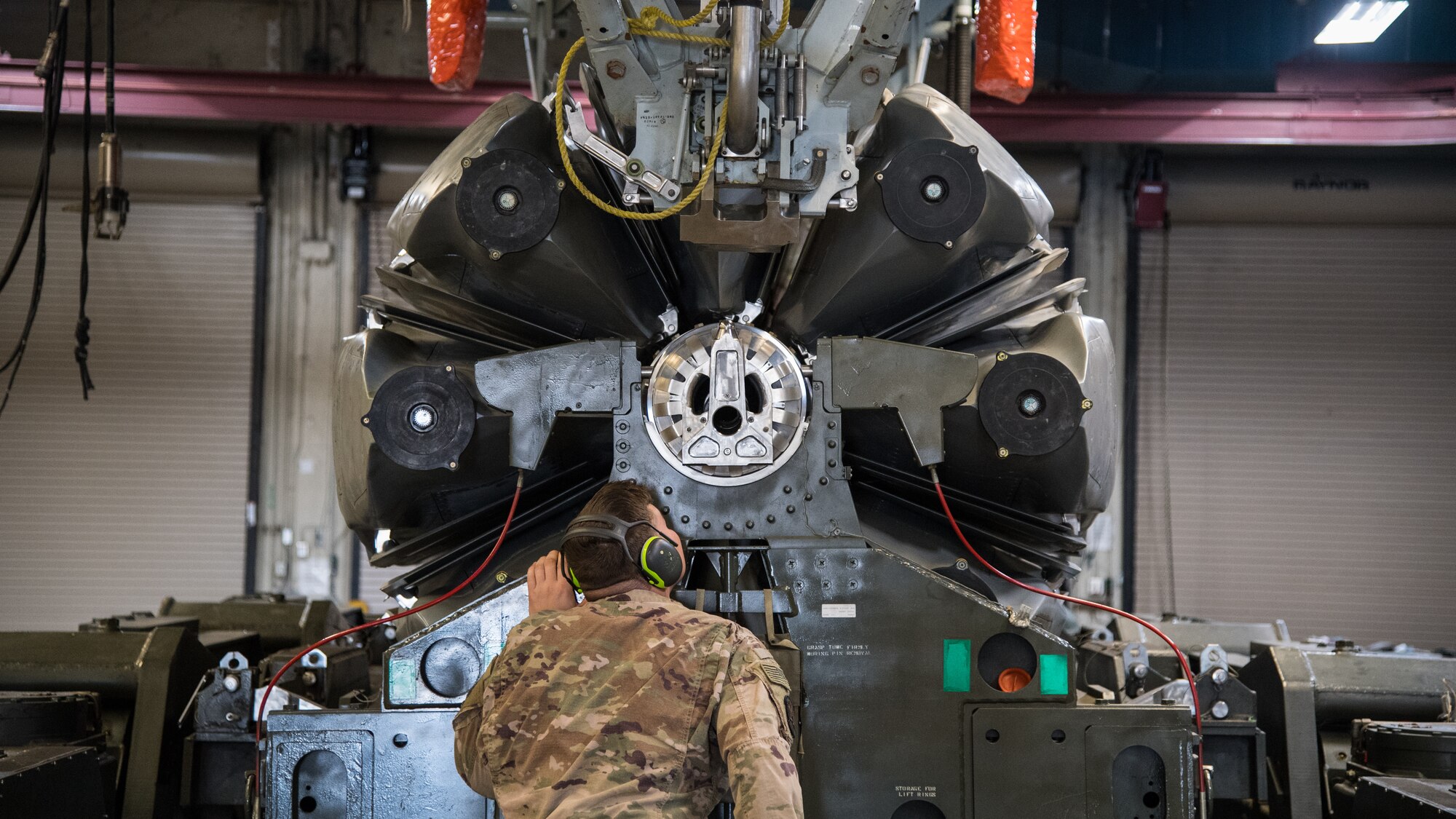 Senior Airman Ryan B. Jarvis, 2nd Munitions Squadron launcher maintenance technician, watches as the last Conventional Air-Launched Cruise Missile (CALCM) is loaded into a launcher at Barksdale Air Force Base, La., Nov. 20, 2019. The 2nd MUNS loaded the final CALCM missile package into a launcher in order to disassemble the weapon to become demilitarized. (U.S. Air Force photo by Airman 1st Class Jacob B. Wrightsman)