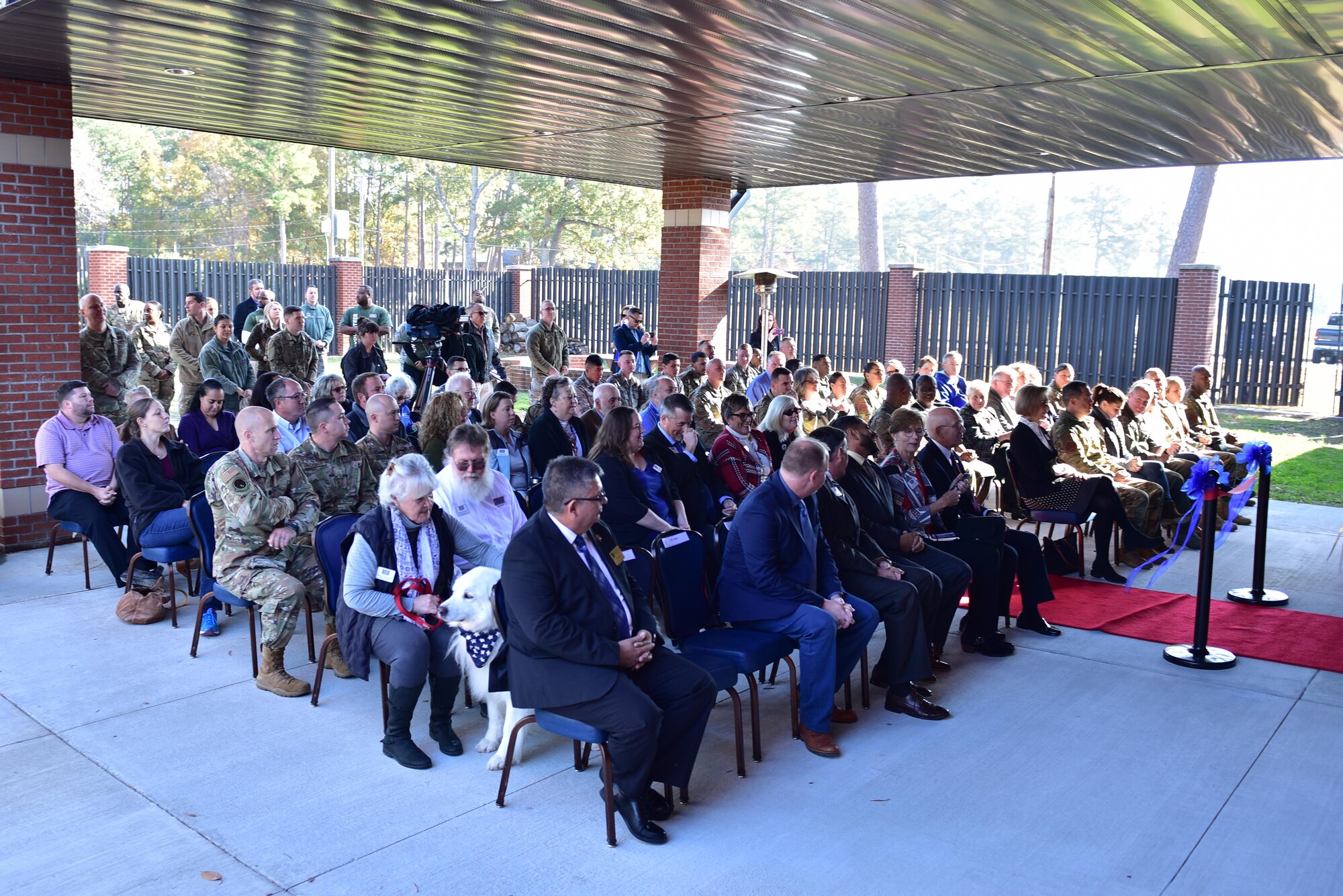 Members of Team Seymour, the USO of North Carolina and others attend the ribbon cutting ceremony honoring the opening of a new USO of NC center. The USO of NC – SJAFB Center is the home to the first USO E-Sports gaming arena, which includes 10 top-of-the-line gaming computers, gaming consoles and stations for guests who choose to bring their personal consoles. (U.S. Air Force photo by Senior Airman Victoria Boyton)