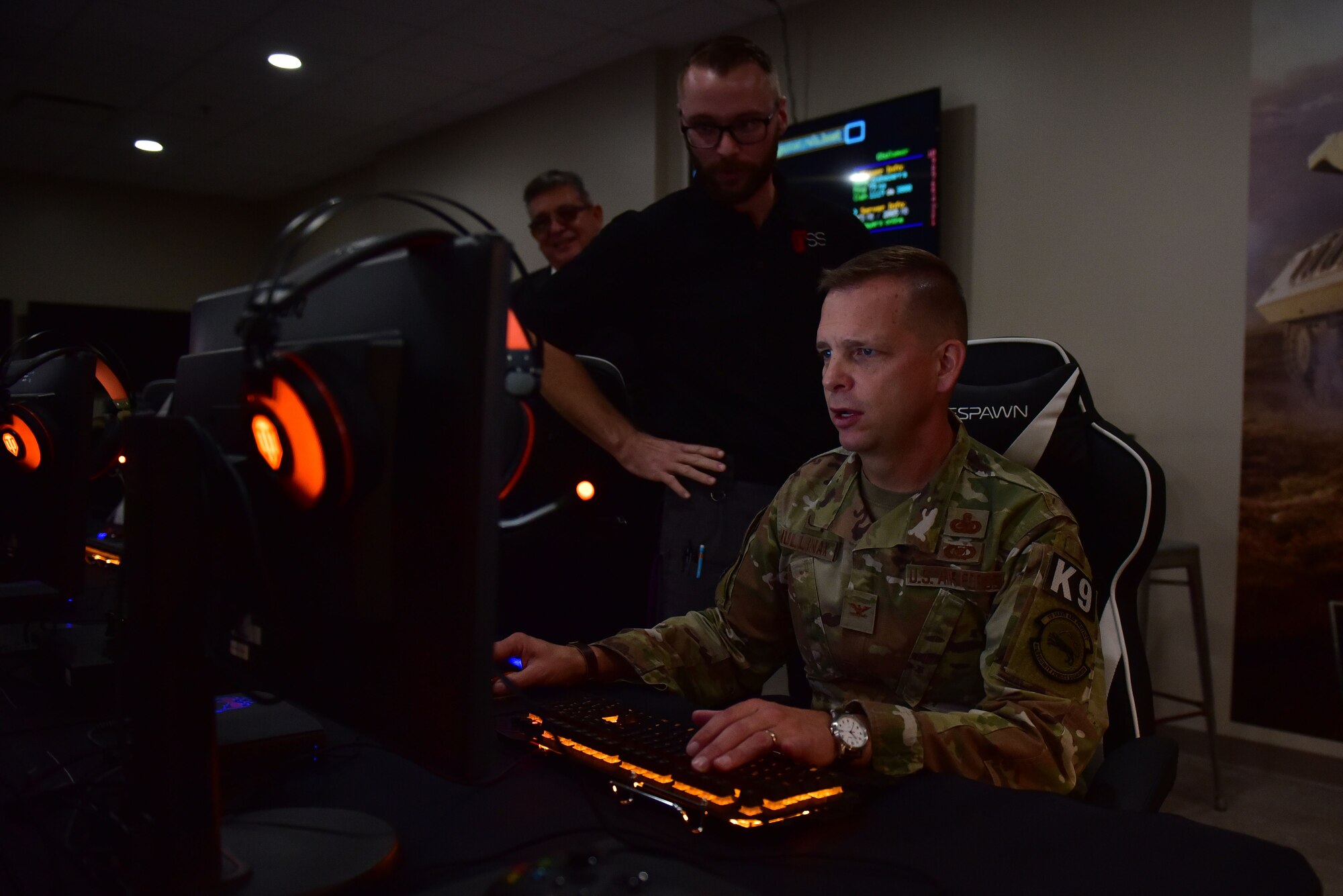 Col. Anthony Mullinax, 4th Mission Support Group commander, plays in the new USO of North Carolina center during the grand opening, Nov. 21, 2019, at Seymour Johnson Air Force Base, N.C. The USO of NC – SJAFB Center is home to the first USO E-Sports gaming arena, which includes 10 top-of-the-line gaming computers, gaming consoles and stations for guests who choose to bring their personal consoles. (U.S. Air Force photo by Senior Airman Victoria Boyton)