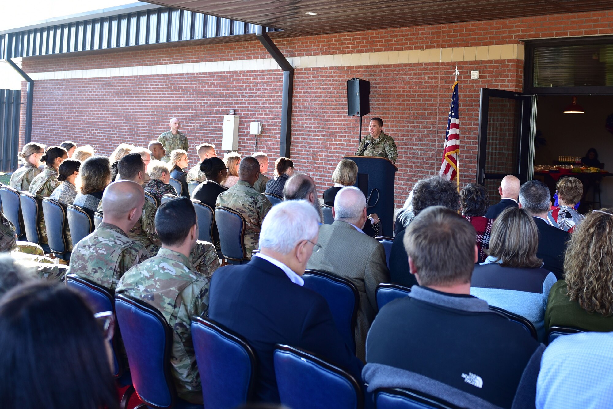 Col. Donn Yates, 4th Fighter Wing commander, addresses attendees at the ribbon cutting ceremony of a new USO of North Carolina center, Nov. 21, 2019, at Seymour Johnson Air Force Base, N.C. The new USO of NC – SJAFB Center includes a coffee station, lounge area, conference table and the first ever USO E-Sports gaming arena. (U.S. Air Force photo by Senior Airman Victoria Boyton)