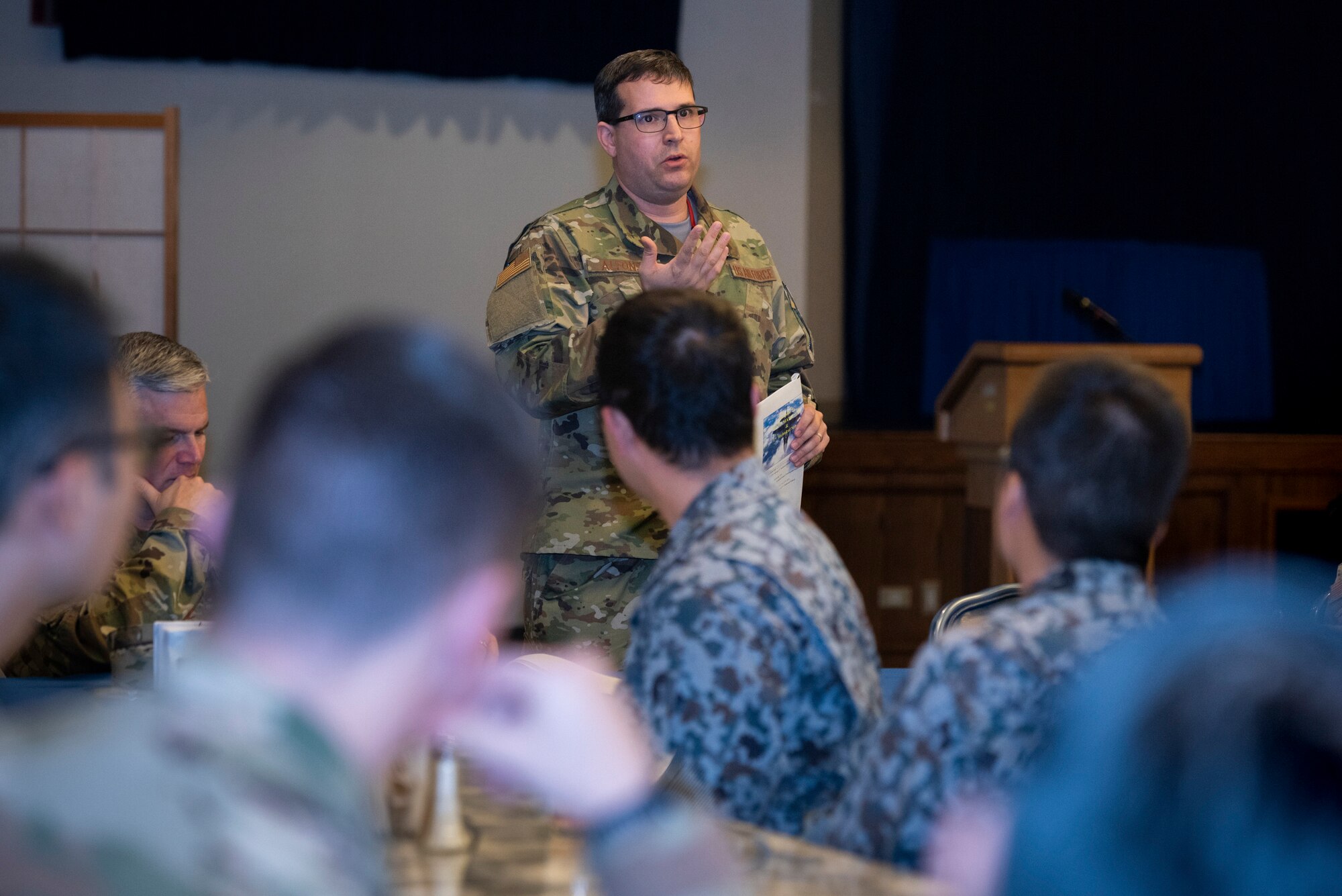 U.S. Air Force Capt. Christopher Alfonso, maintenance exchange officer assigned to the Japanese Air Self-Defense Force’s First Technical School at Hamamatsu Air Base, Japan, briefs 374th Maintenance Group members during a basic maintenance officer tour at Yokota Air Base, Japan, Nov. 21, 2019.