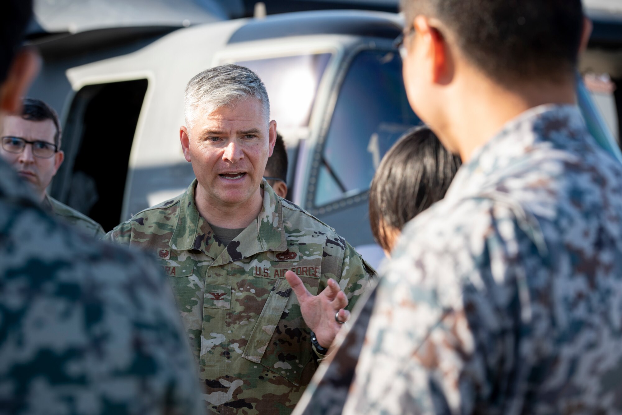 Col. Todd Wydra, 374th Maintenance Group commander, answers a question from a Japanese Air Self‐ Defense Force Lieutenant during a basic maintenance officer tour at Yokota Air Base, Japan, Nov. 21, 2019.