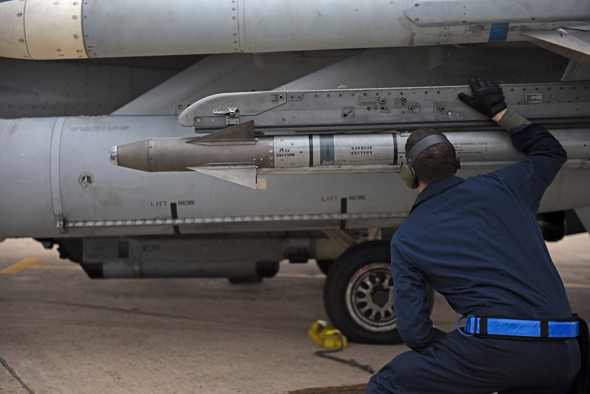 A U.S. Air Force maintainer assigned to the 35th Aircraft Maintenance Unit conducts a pre-flight inspection at Kunsan Air Base, Republic of Korea, Nov. 19, 2019. The 8th Maintenance Group provides on- and off-equipment maintenance on F-16 Fighting Falcons. The group also provides munitions, aircraft maintenance and maintenance operations support. (U.S. Air Force photo by Staff Sgt. Mackenzie Mendez)
