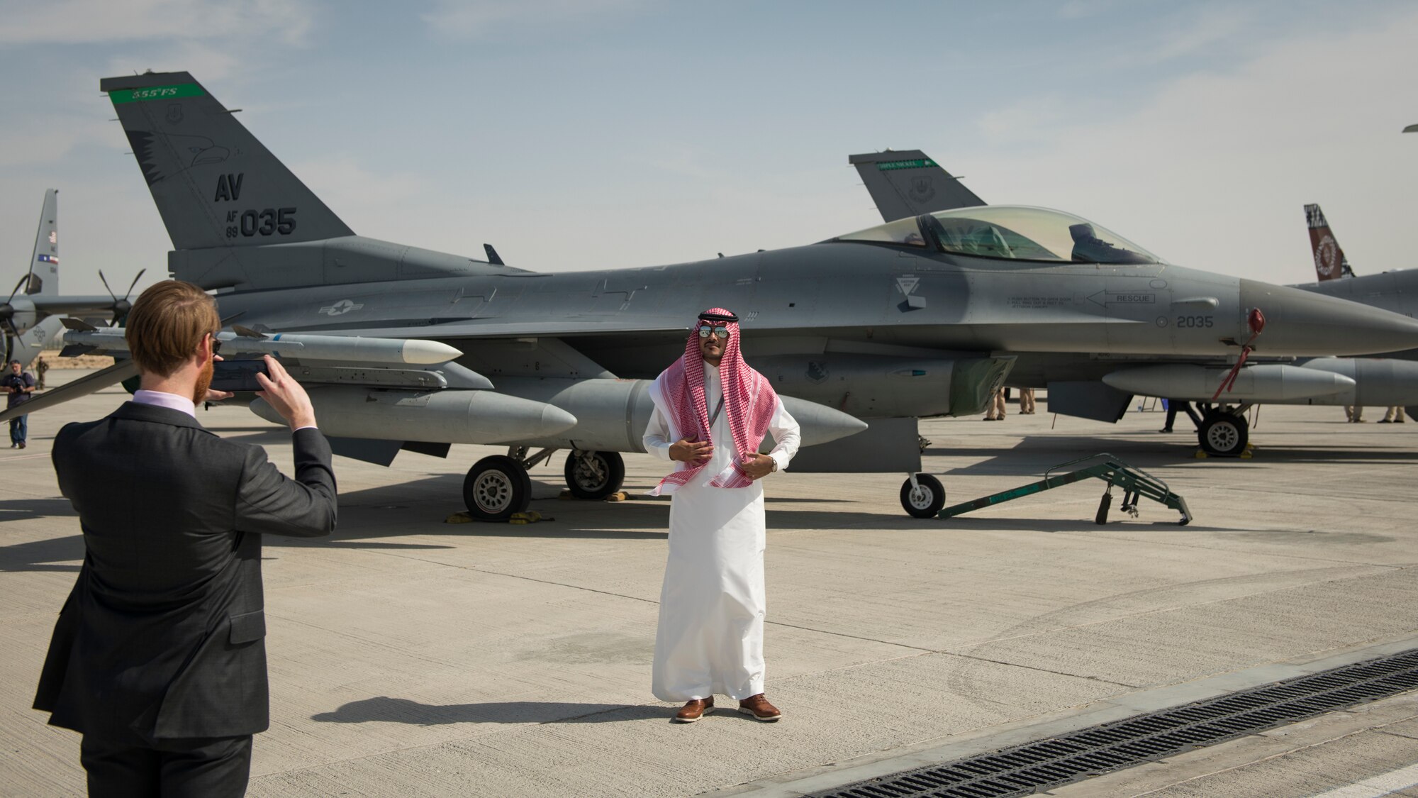 A spectator photographs a U.S. Air Force F-16 Fighting Falcon at the Dubai Airshow, United Arab Emirates, Nov. 17, 2019.