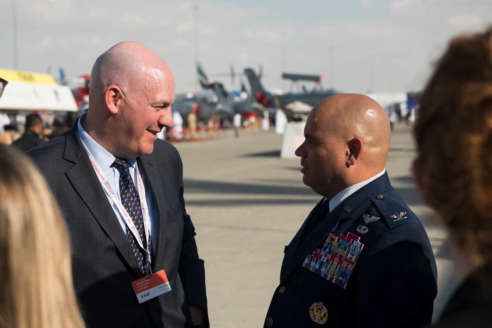 R. Clarke Cooper, left, Assistant Secretary of State for Political-Military Affairs, greets U.S. Air Force Col. Thomas Goulter, Director of Theater Security Cooperation for U.S. Air Forces Central Command, at the Dubai Airshow, United Arab Emirates, Nov. 17, 2019.