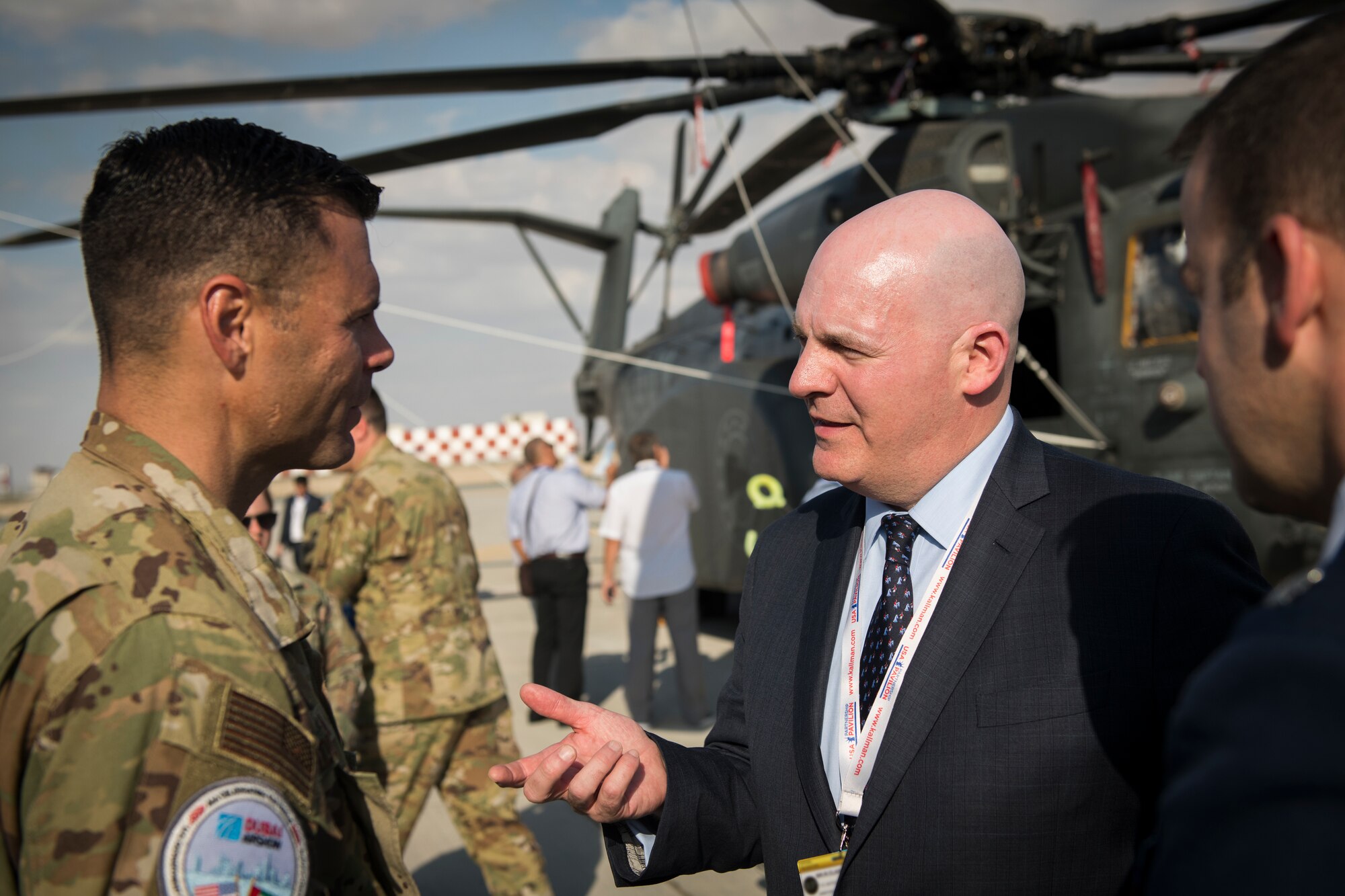 R. Clarke Cooper, left, Assistant Secretary of State for Political-Military Affairs, converses with U.S. Air Force Col. Thad Middleton, commander of the 22nd Operations Group, McConnell Air Force Base, Kansas, at the Dubai Airshow, United Arab Emirates, Nov. 17, 2019.